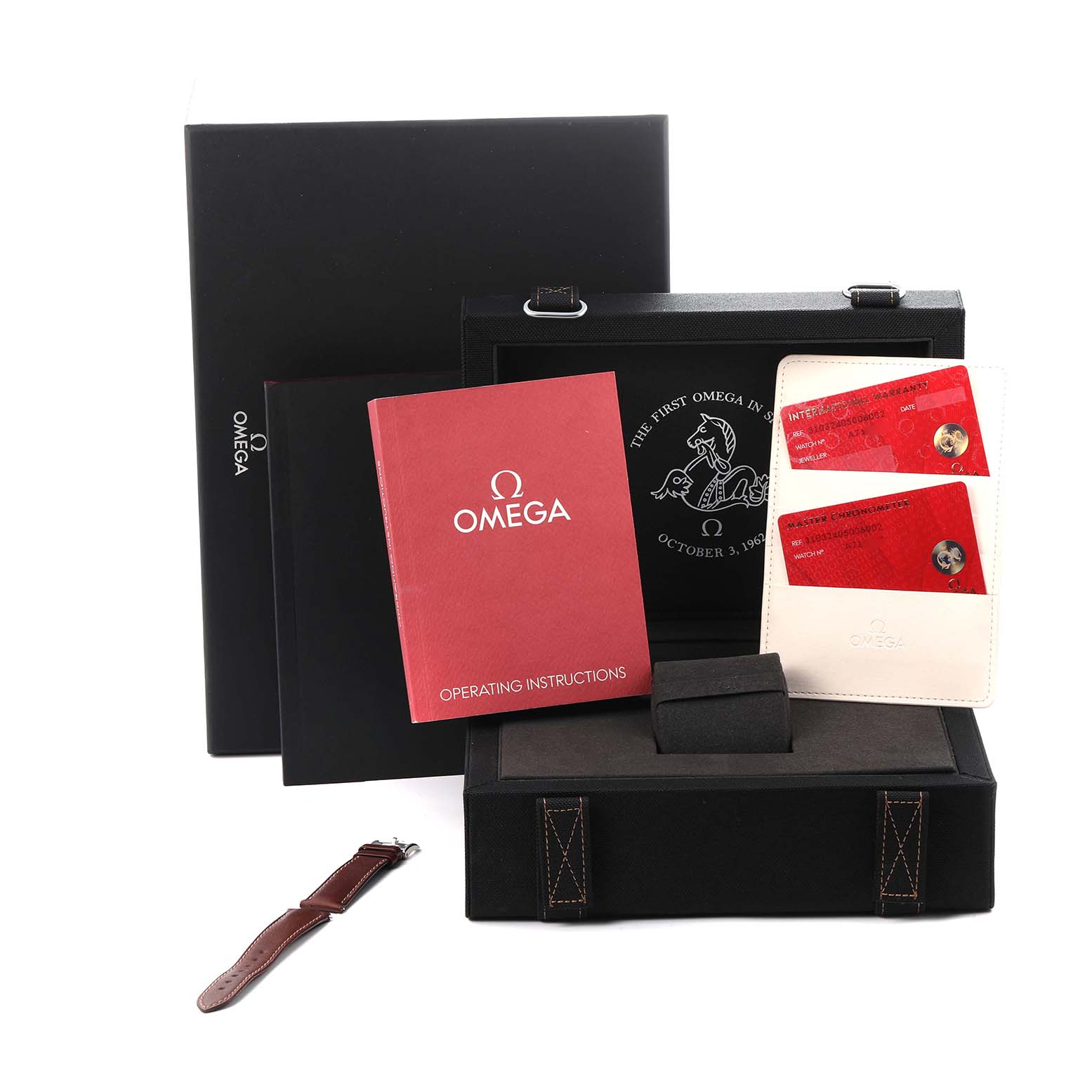 The image shows the packaging and accessories for an Omega Speedmaster model 310.32.40.50.06.002, including a strap, instruction booklet, cards, and a presentation box.