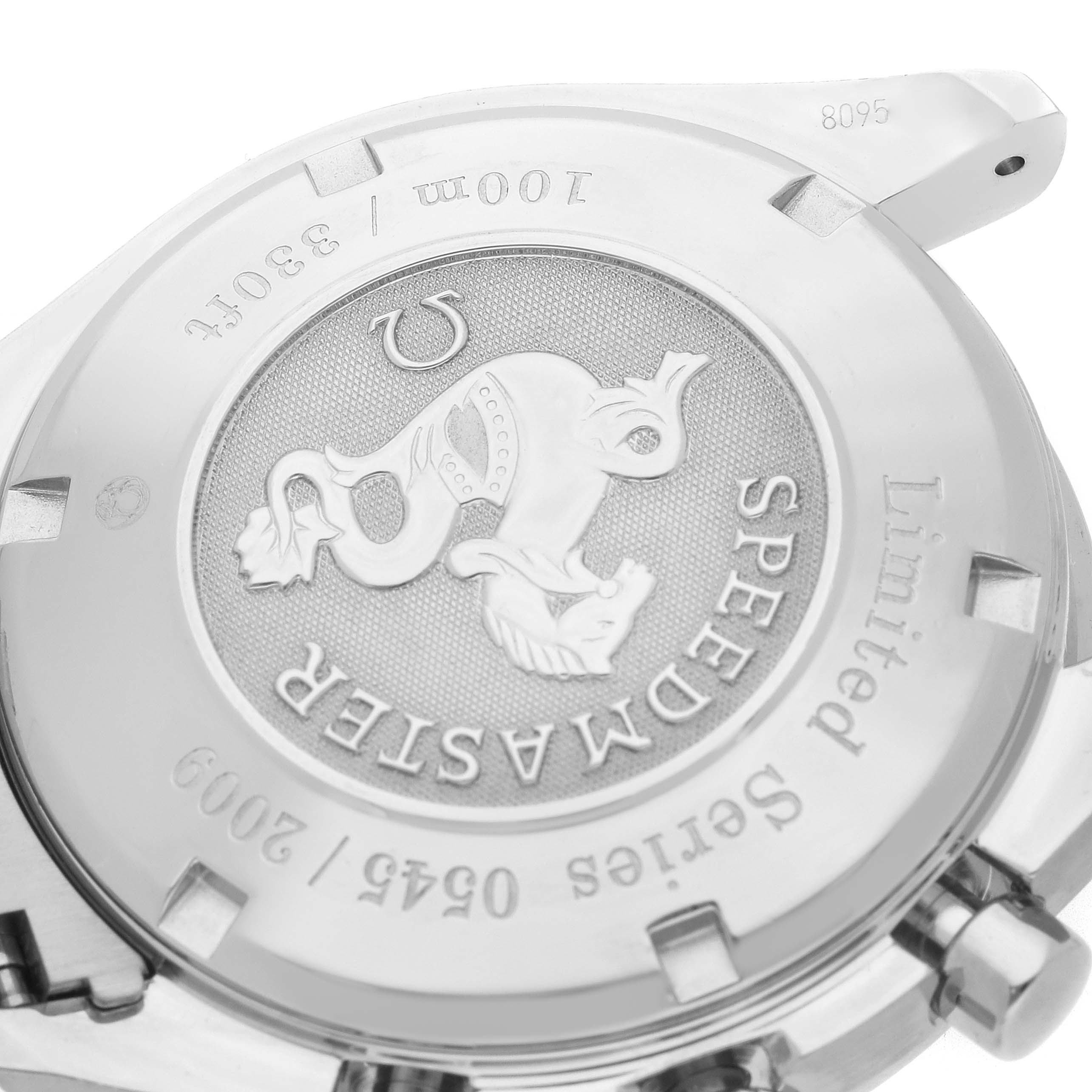 The image shows the back of the Omega Speedmaster model 323.30.40.40.02.001, highlighting the embossed logo and limited edition engraving.