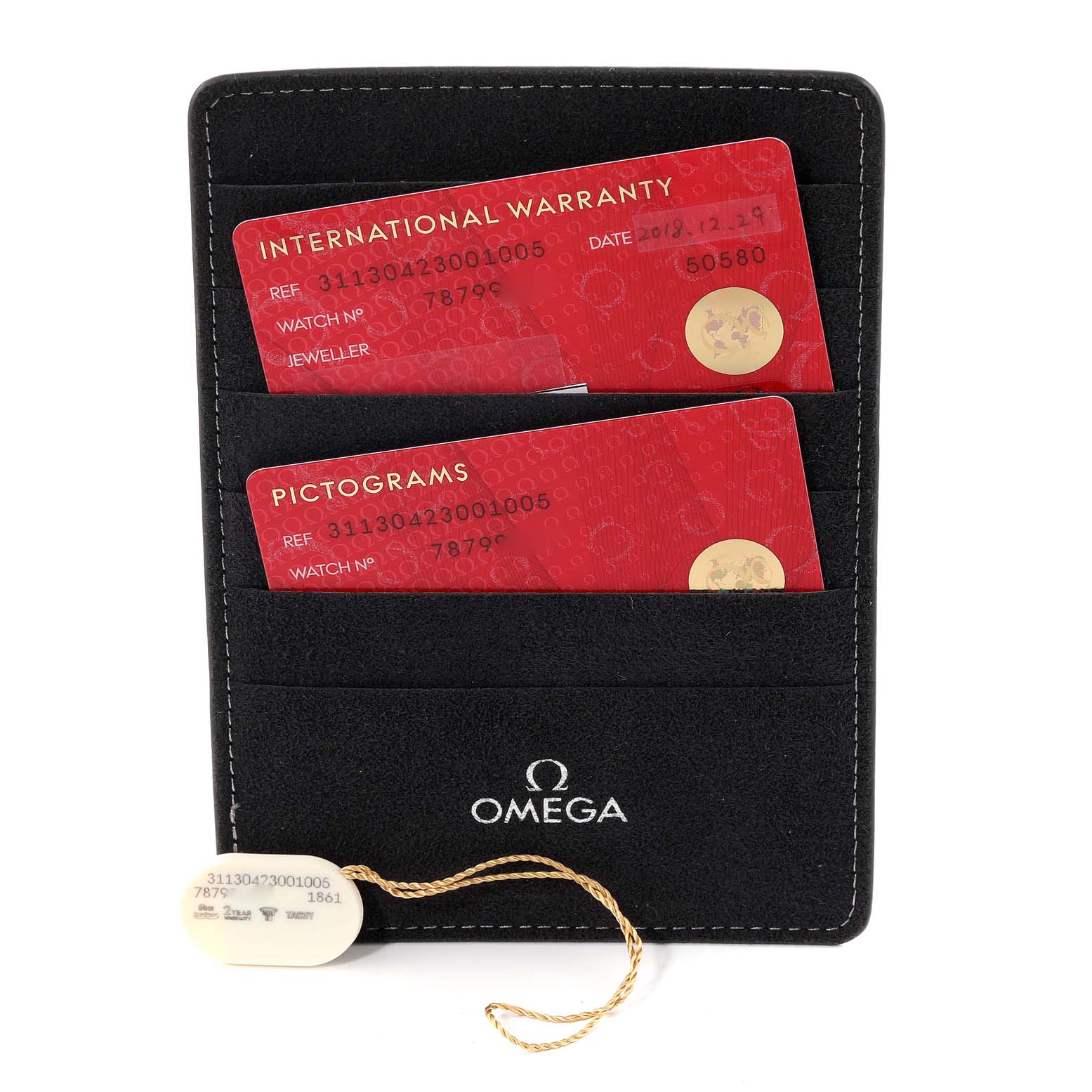 The image shows an Omega Speedmaster 311.30.42.30.01.005 Men
s Stainless Steel Black Dial 311.30.42.30.01.005 Men
s Stainless Steel Black Dial accessory with International Warranty and Pictograms cards in a branded holder.