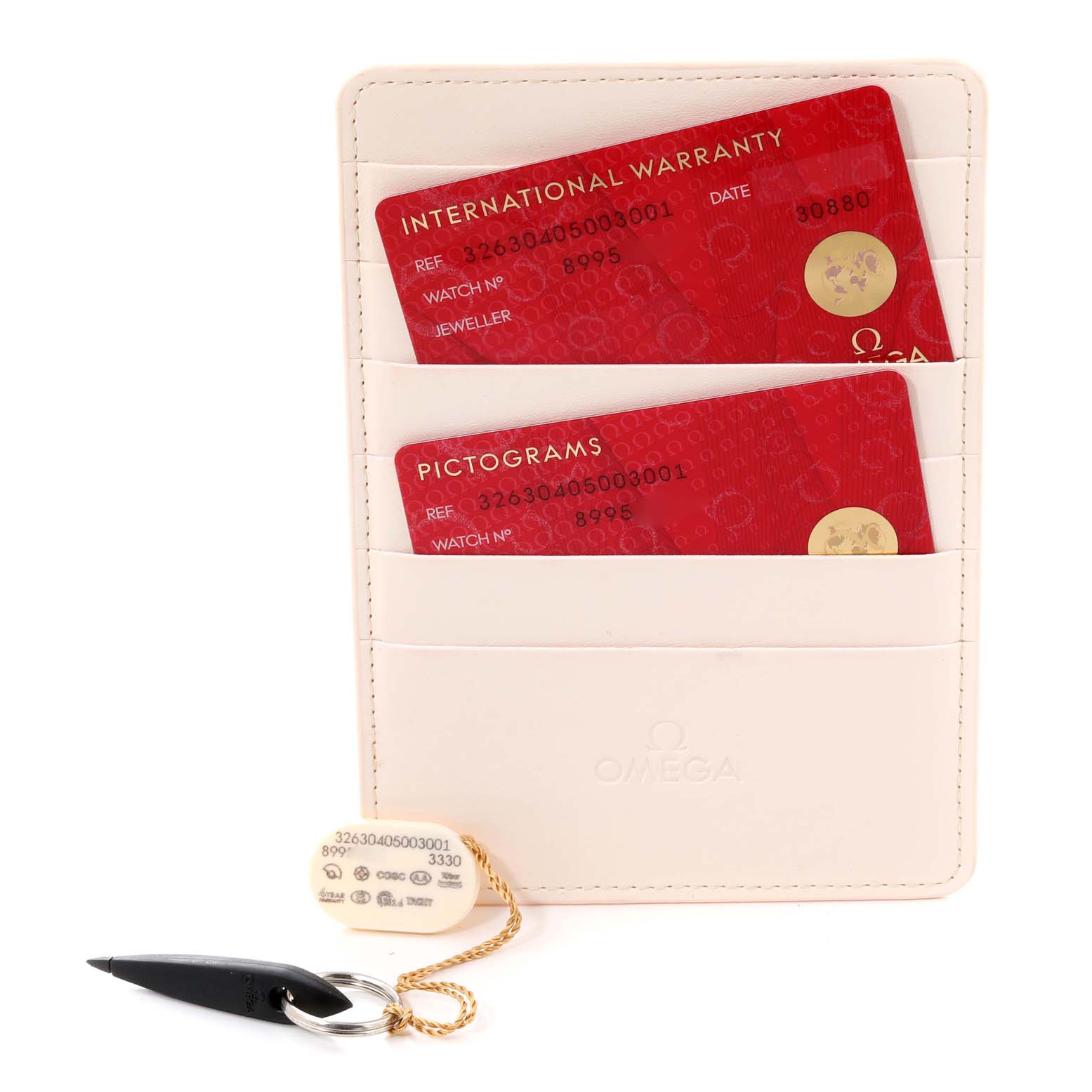 The image shows warranty and pictogram cards along with a tag and tool for an Omega Speedmaster 326.30.40.50.03.001 Men
s Stainless Steel Blue Dial 326.30.40.50.03.001 Men
s Stainless Steel Blue Dial watch.