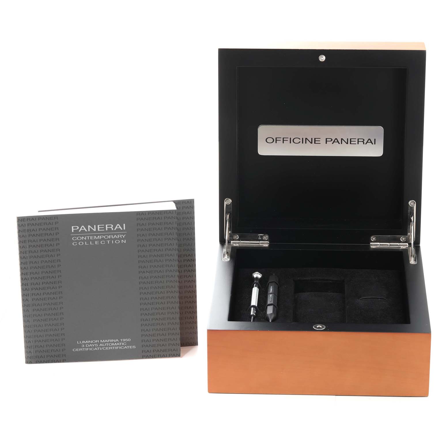 The image shows a Panerai Luminor PAM00312 Men's Stainless Steel Black Dial PAM00312 Men's Stainless Steel Black Dial watch box, open to reveal accessories, and a booklet for the watch model.