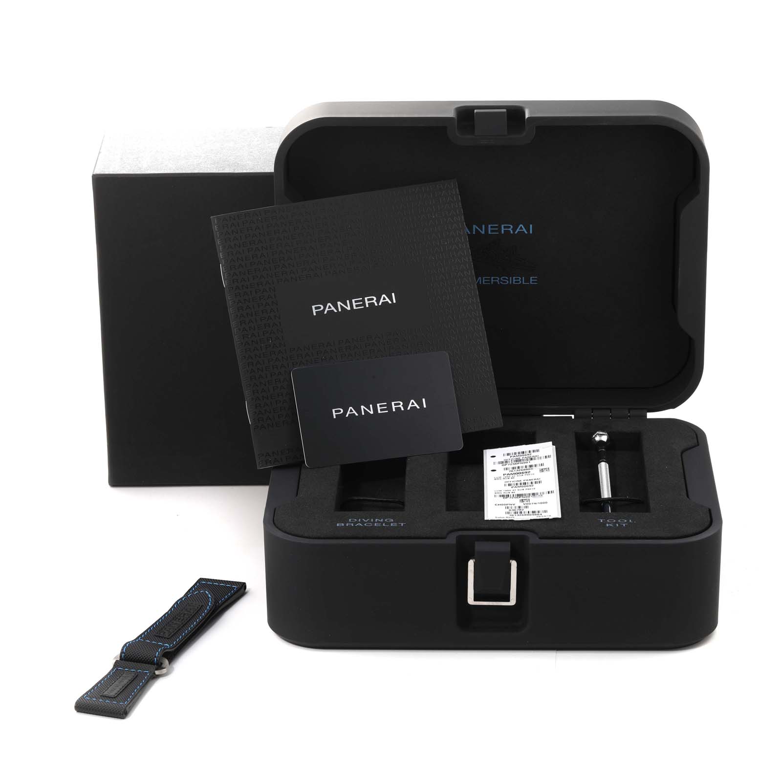 The image shows the Panerai Submersible PAM00692 Men
s Ceramic Blue Dial PAM00692 Men
s Ceramic Blue Dial watch
s open case, additional strap, tools, and documentation from a top-front angle.