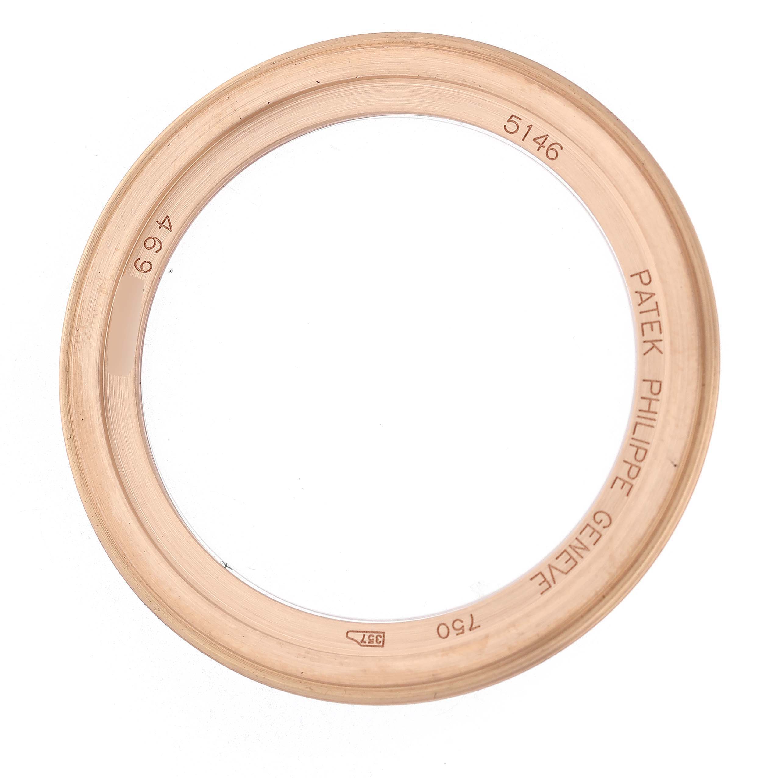 The image shows a rose gold bezel for a Patek Philippe Complications 5146R-001 Men's Rose Gold White Dial model, displaying markings and engravings.