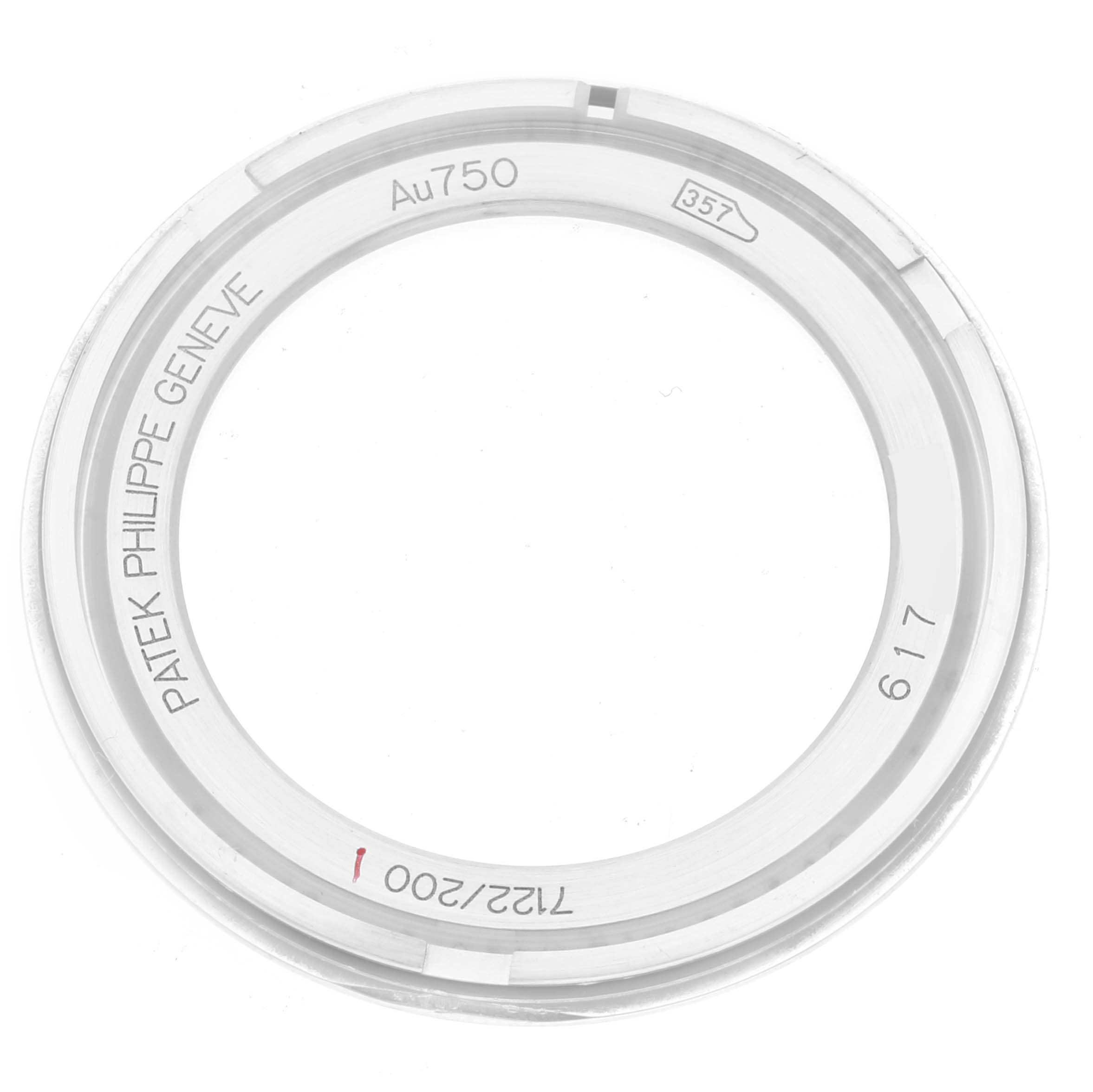 The image shows a bezel for the Patek Philippe Calatrava 7122/200G Women's White Gold White Dial 7122/200G Women's White Gold White Dial model, viewed from above with engraved markings visible.