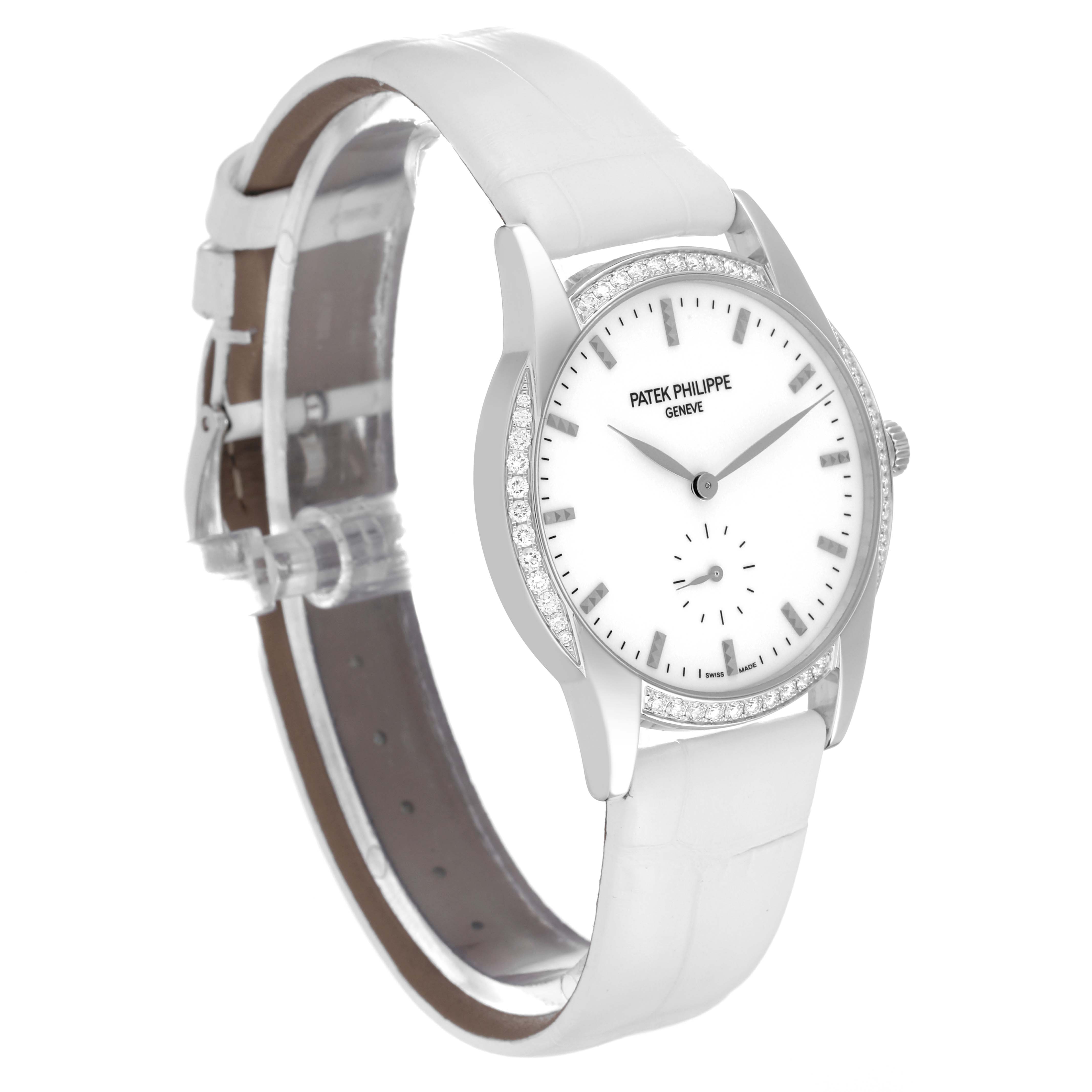 The image showcases a Patek Philippe Calatrava 7122/200G Women's White Gold White Dial 7122/200G Women's White Gold White Dial watch at an angled side view, highlighting its dial, bezel, and leather strap.