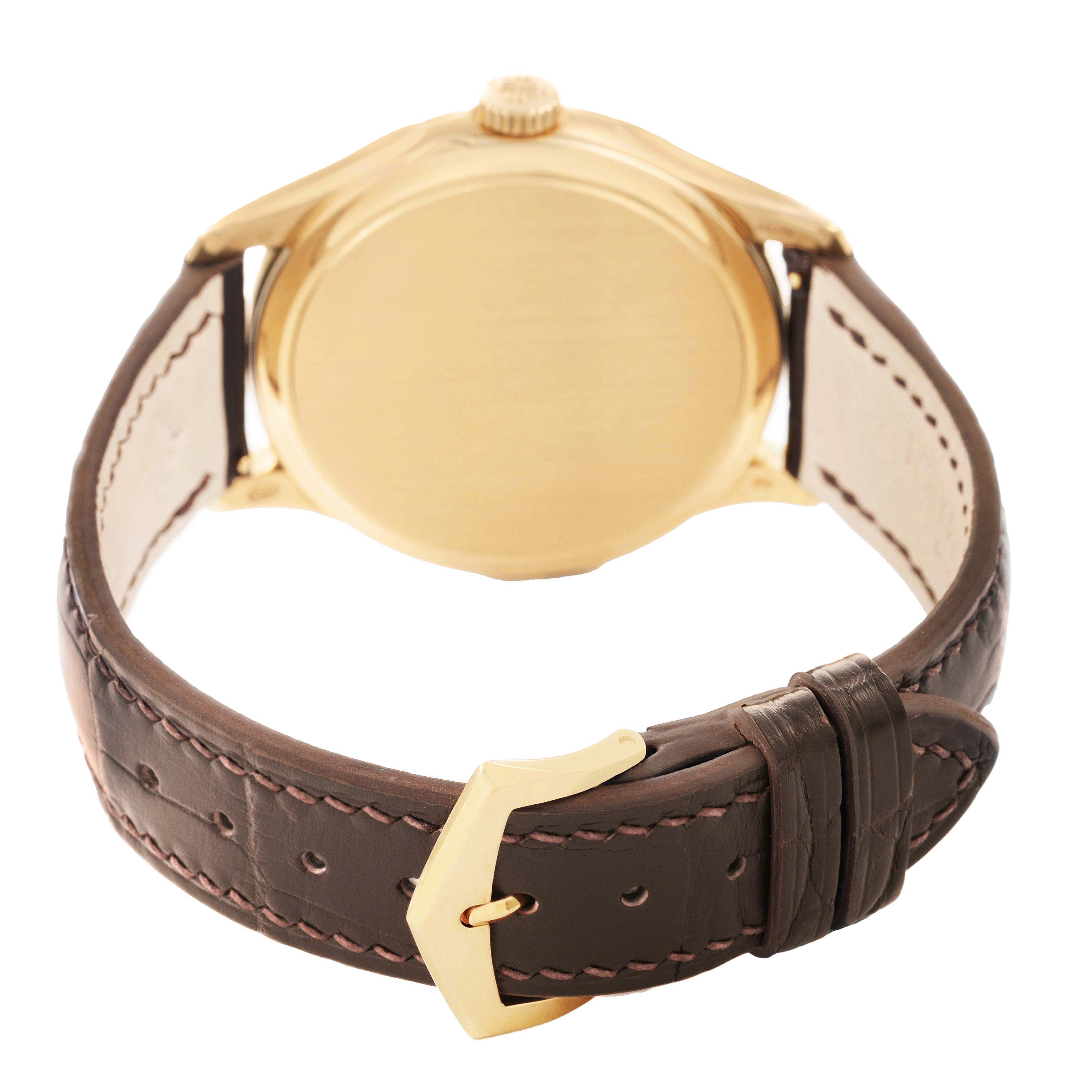 The Patek Philippe Calatrava 5227J Men's Yellow Gold White Dial watch is shown from the back angle, focusing on the case back, crown, and brown leather strap with buckle.