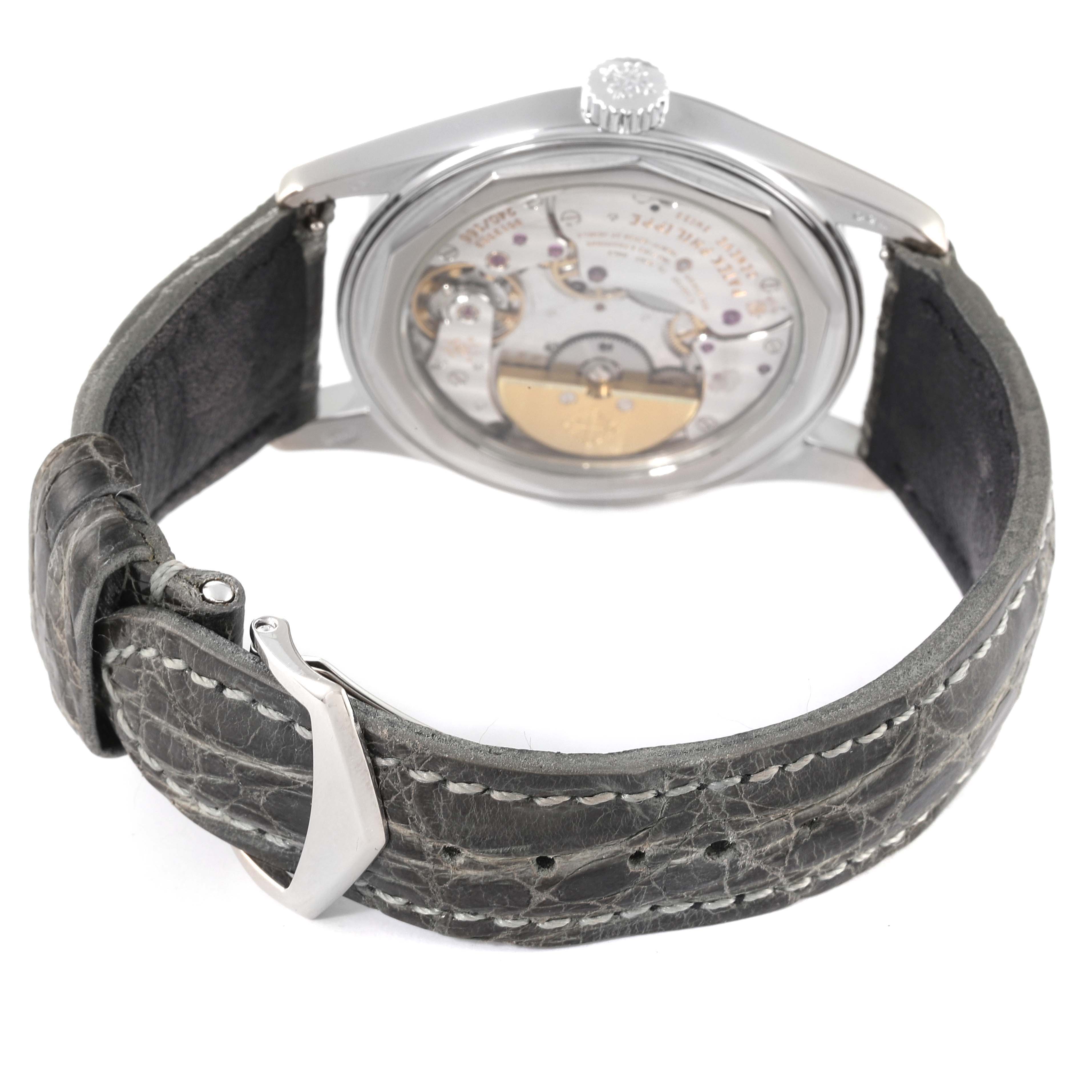 The image shows the back view of a Patek Philippe Calatrava 6000G Men's White Gold Grey Dial 6000G Men's White Gold Grey Dial watch, highlighting the leather strap and transparent case back.