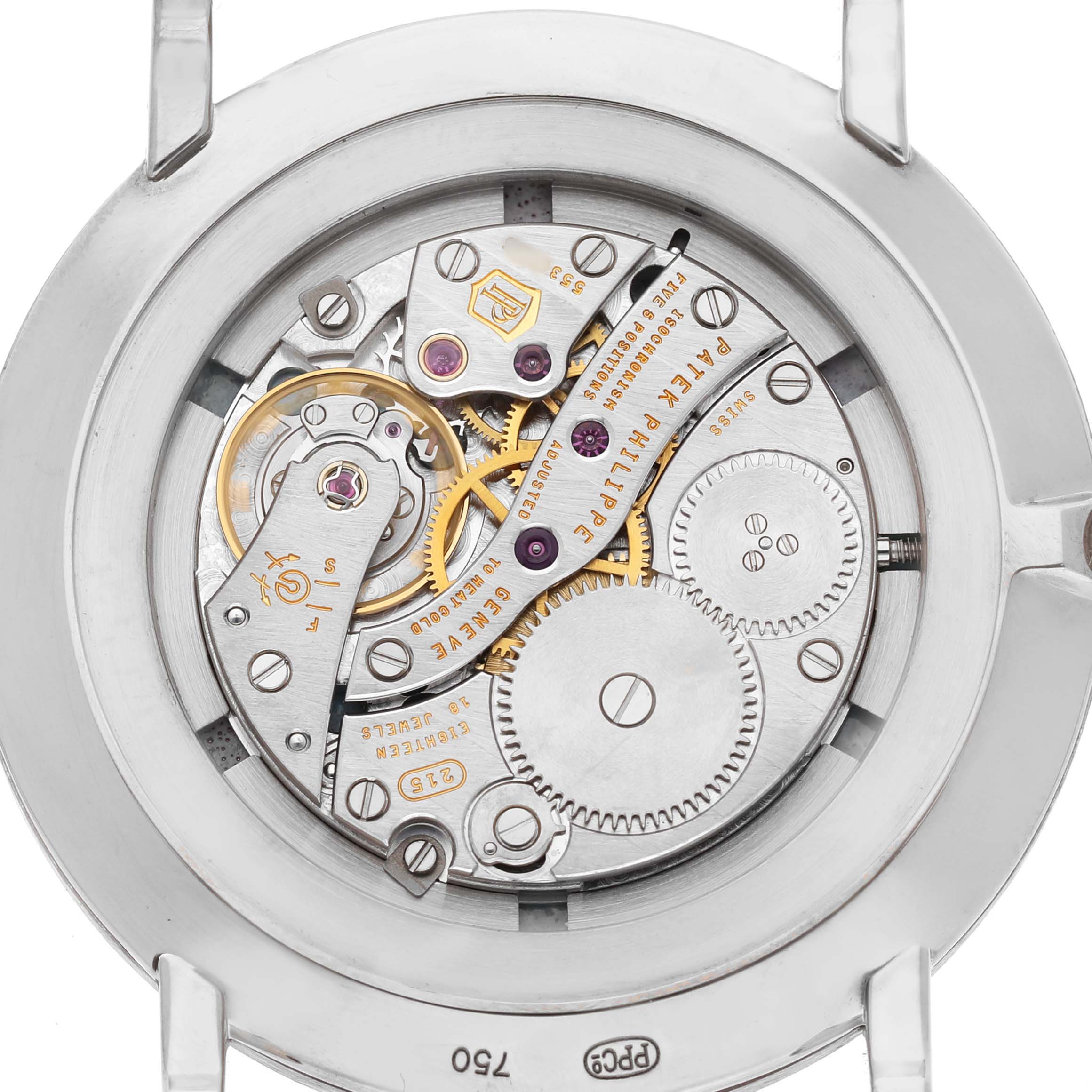 The image shows the movement of a Patek Philippe Calatrava 5116G Men's White Gold White Dial watch, highlighting gears and inscriptions from the back angle.