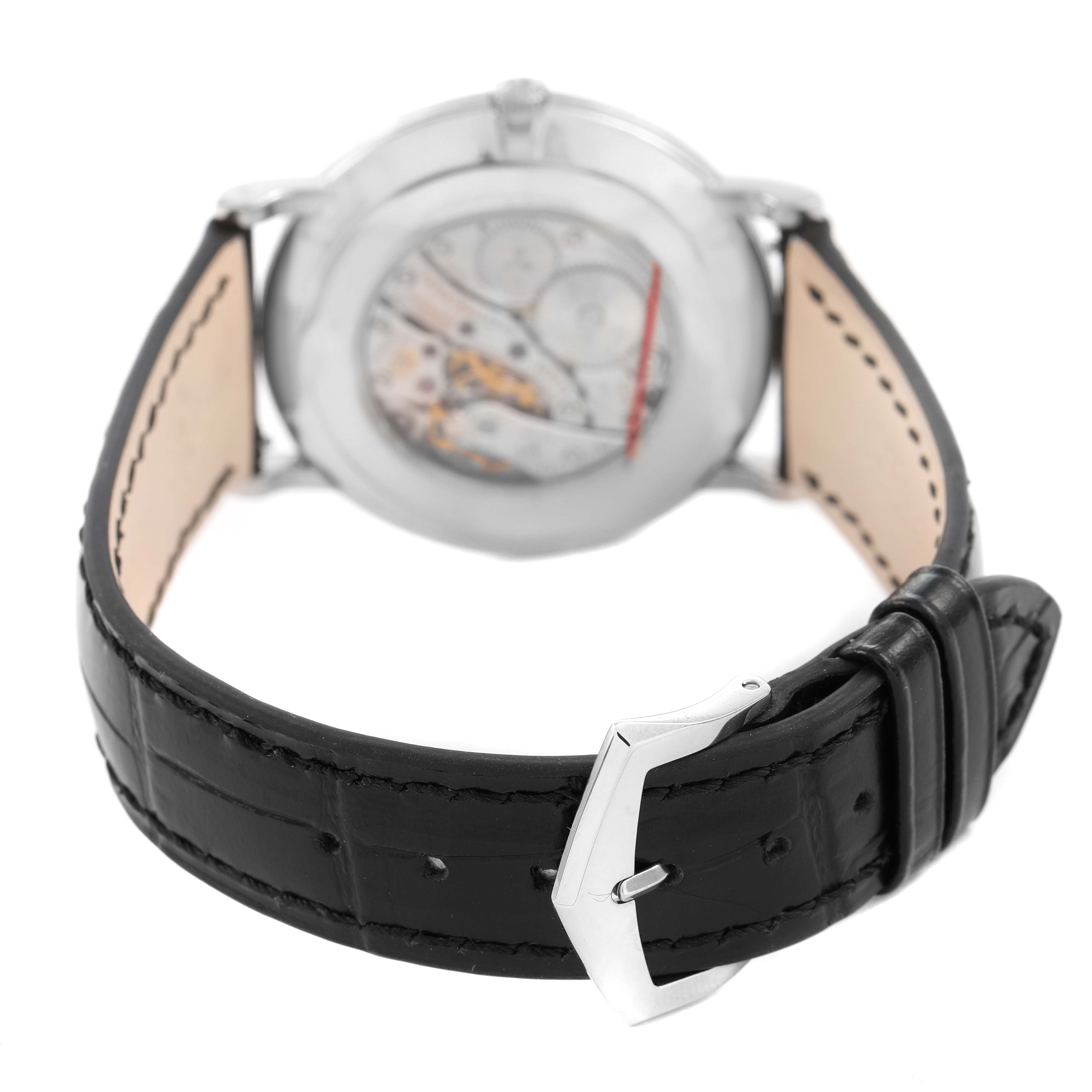 The image shows the back of the Patek Philippe Calatrava 5116G Men's White Gold White Dial watch, focusing on the open case back and leather strap with buckle.
