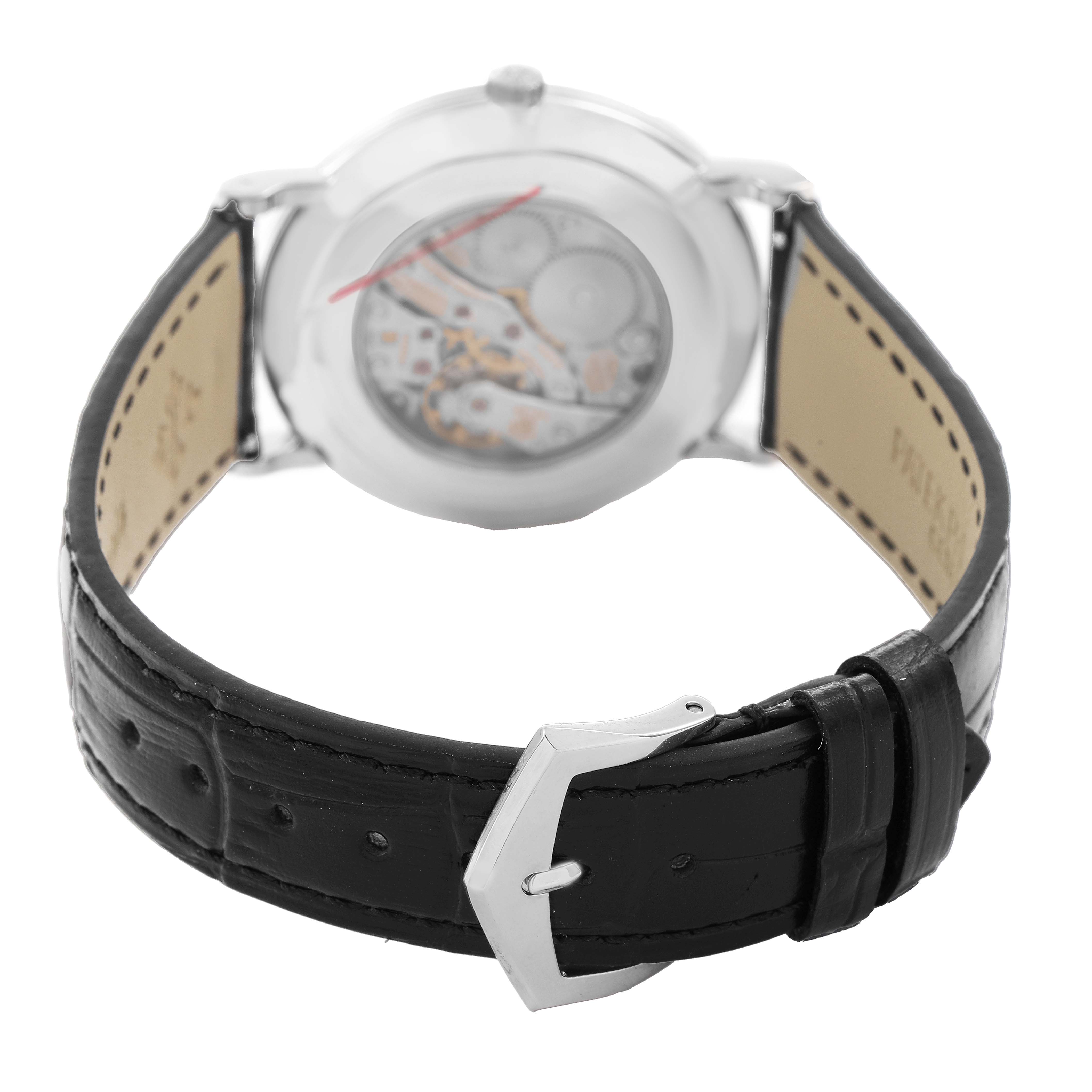 The image shows the back view of a Patek Philippe Calatrava 5119G-001 Men's White Gold White Dial watch, highlighting its leather strap and open case back.