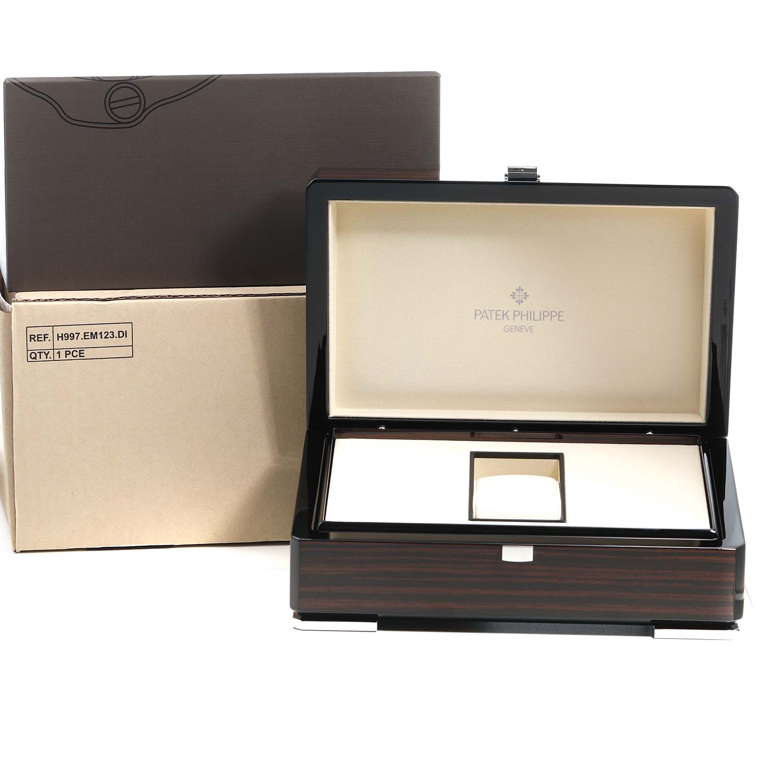 The image shows an open Patek Philippe Gondolo 5135G-001 Men's White Gold Grey Dial watch box with its cushion and outer packaging from a front angle.