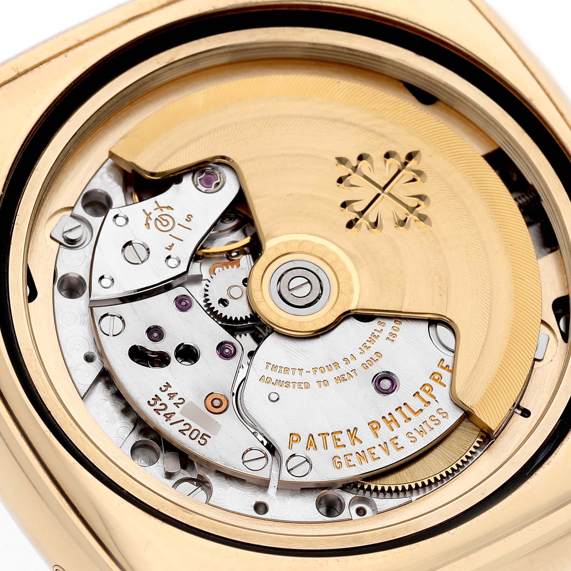 This image shows the intricate movement and rotor of the Patek Philippe Gondolo 5135J-001 Men's Yellow Gold Silver Dial, viewed from the back.
