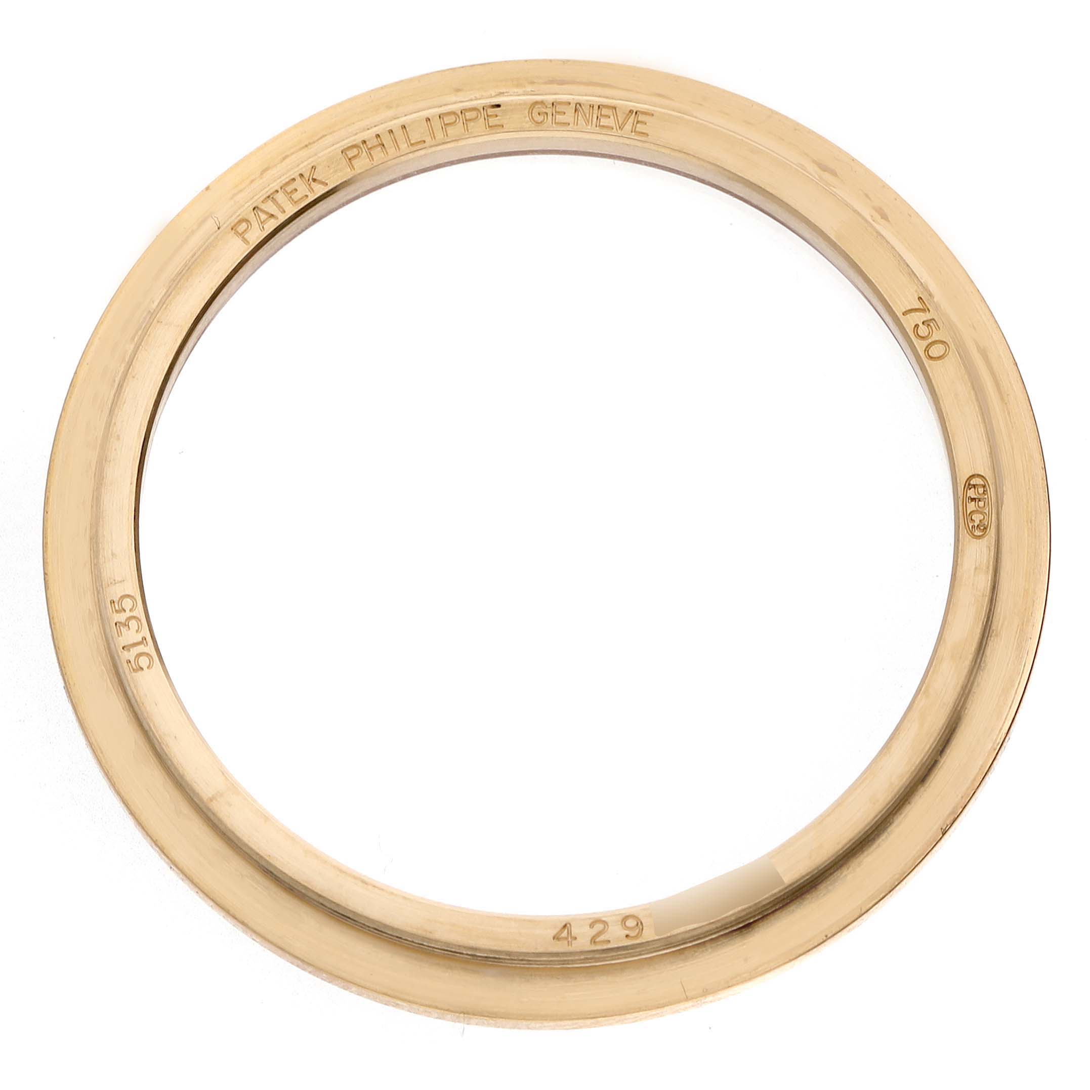 The image shows a gold bezel or ring part of the Patek Philippe Gondolo 5135J-001 Men's Yellow Gold Silver Dial watch, viewed from above.