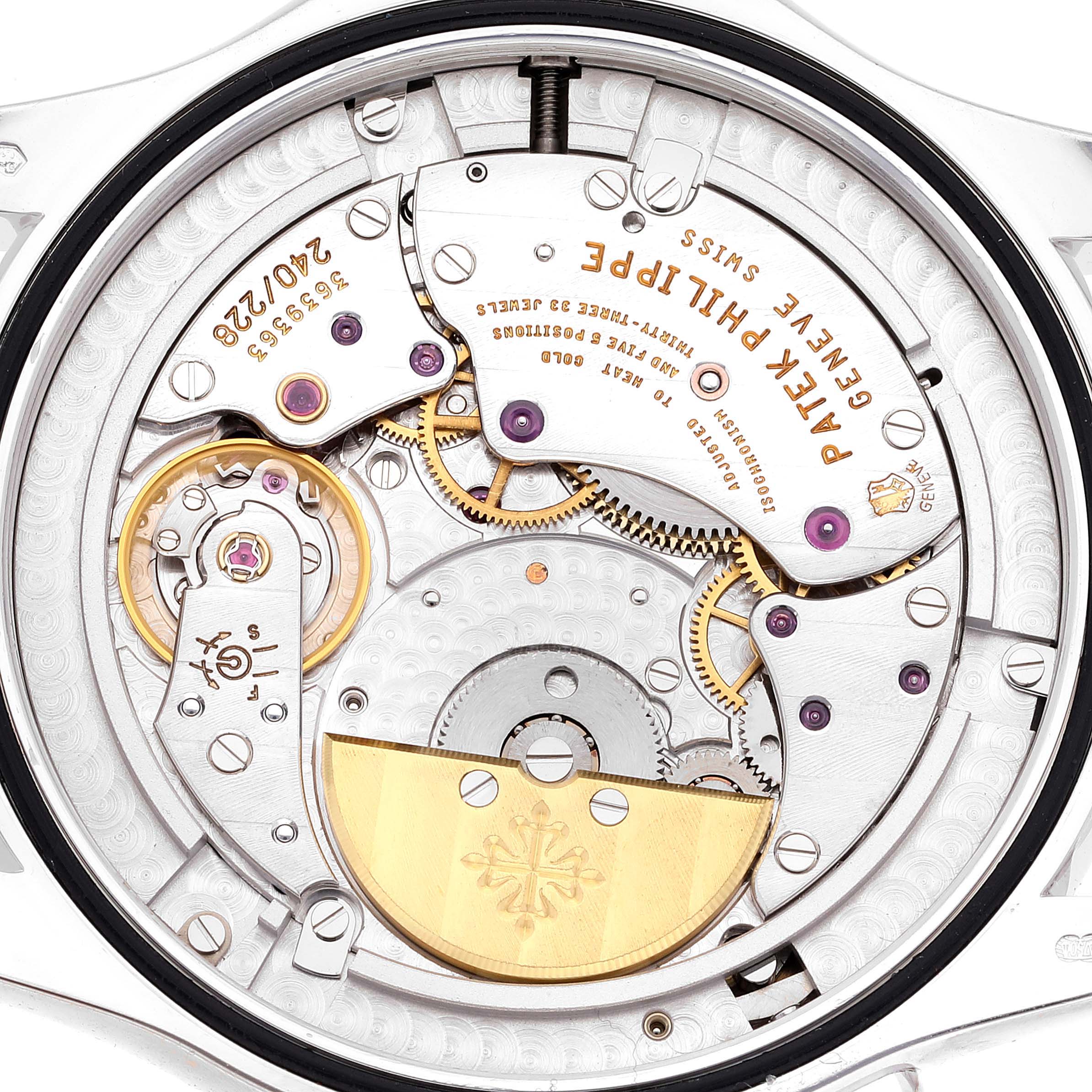 The image shows the backside movement of the Patek Philippe Complications 5130G Men
s White Gold Silver Dial 5130G Men
s White Gold Silver Dial watch, highlighting its intricate mechanical parts.