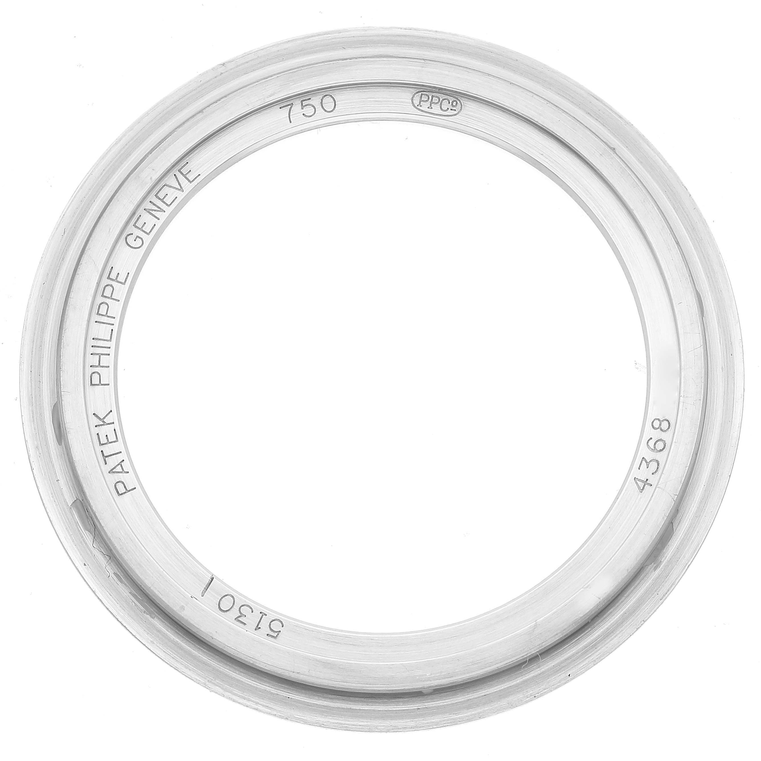 The image shows a top view of the bezel for a Patek Philippe Complications 5130G Men
s White Gold Silver Dial 5130G Men
s White Gold Silver Dial watch.