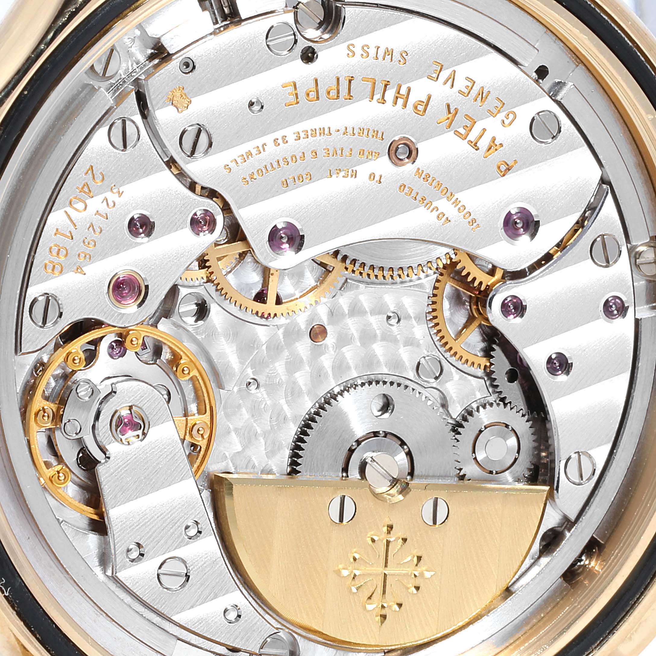 This image shows the intricate inner mechanism and craftsmanship of the Patek Philippe Complications 5110J Men's Yellow Gold Silver Dial 5110J Men's Yellow Gold Silver Dial watch, viewed from the back.