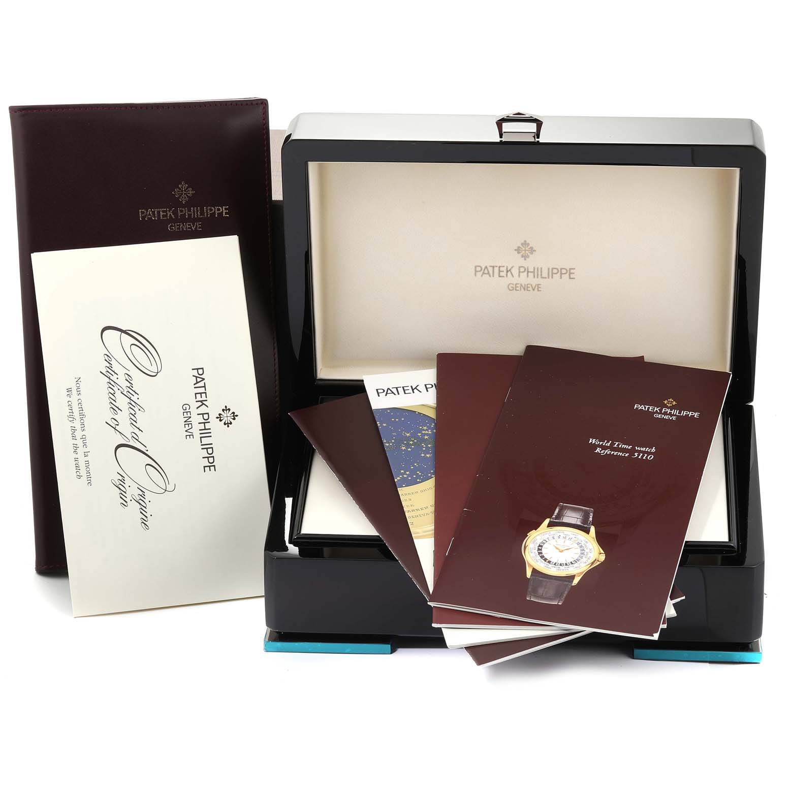 The image shows the packaging and documents for a Patek Philippe Complications 5110J Men's Yellow Gold Silver Dial 5110J Men's Yellow Gold Silver Dial model watch, including the case, manuals, and certificate.