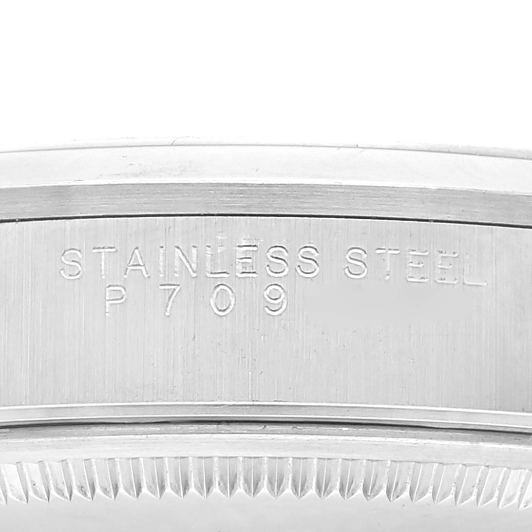 The image shows a close-up of the side of an Air-King model by Rolex, highlighting the "Stainless Steel P709" engraving.