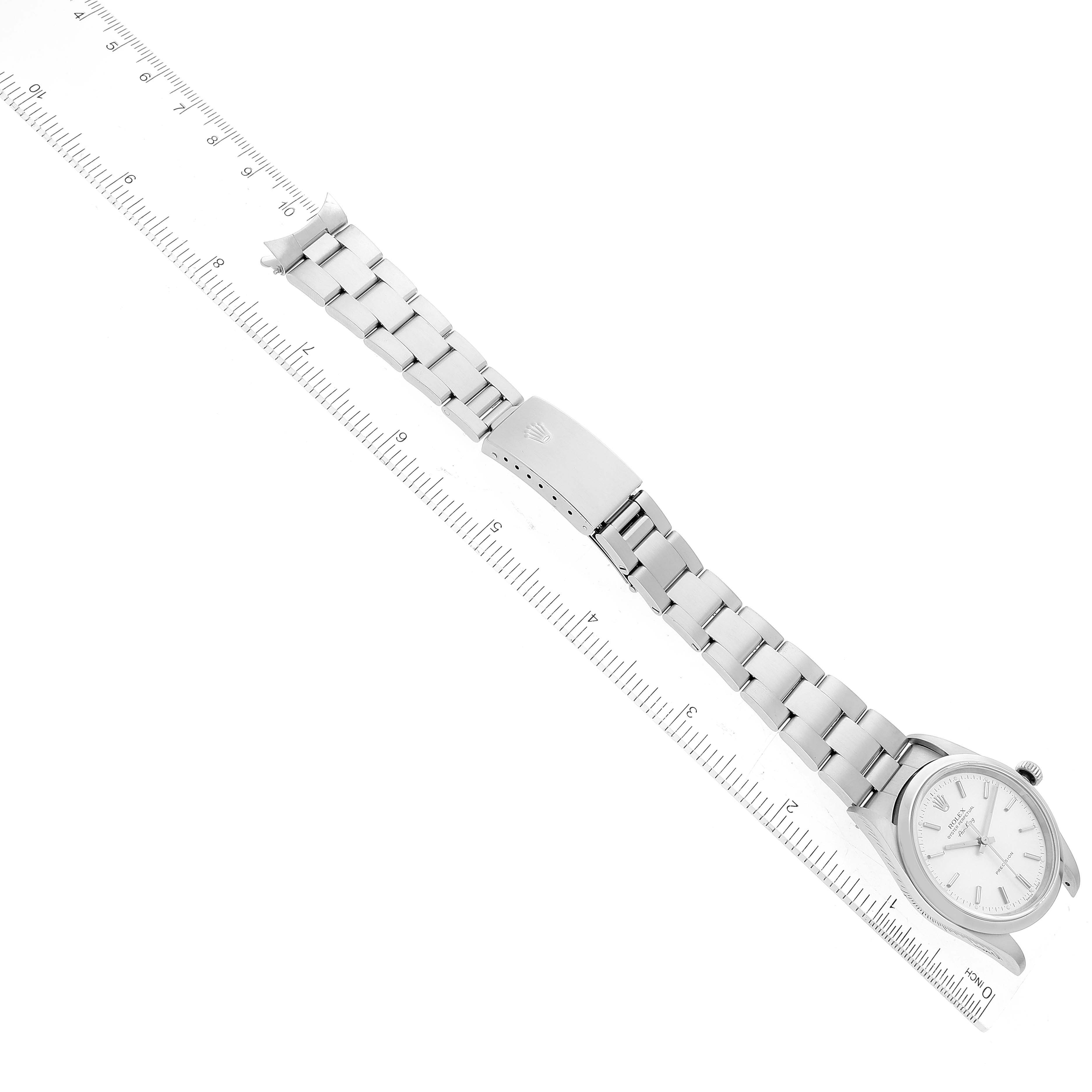 The image shows a top-down angled view of a Rolex Air-King 14000 Men's Stainless Steel Red Dial 14000 Men's Stainless Steel Red Dial watch, with its bracelet fully extended and a ruler for scale.