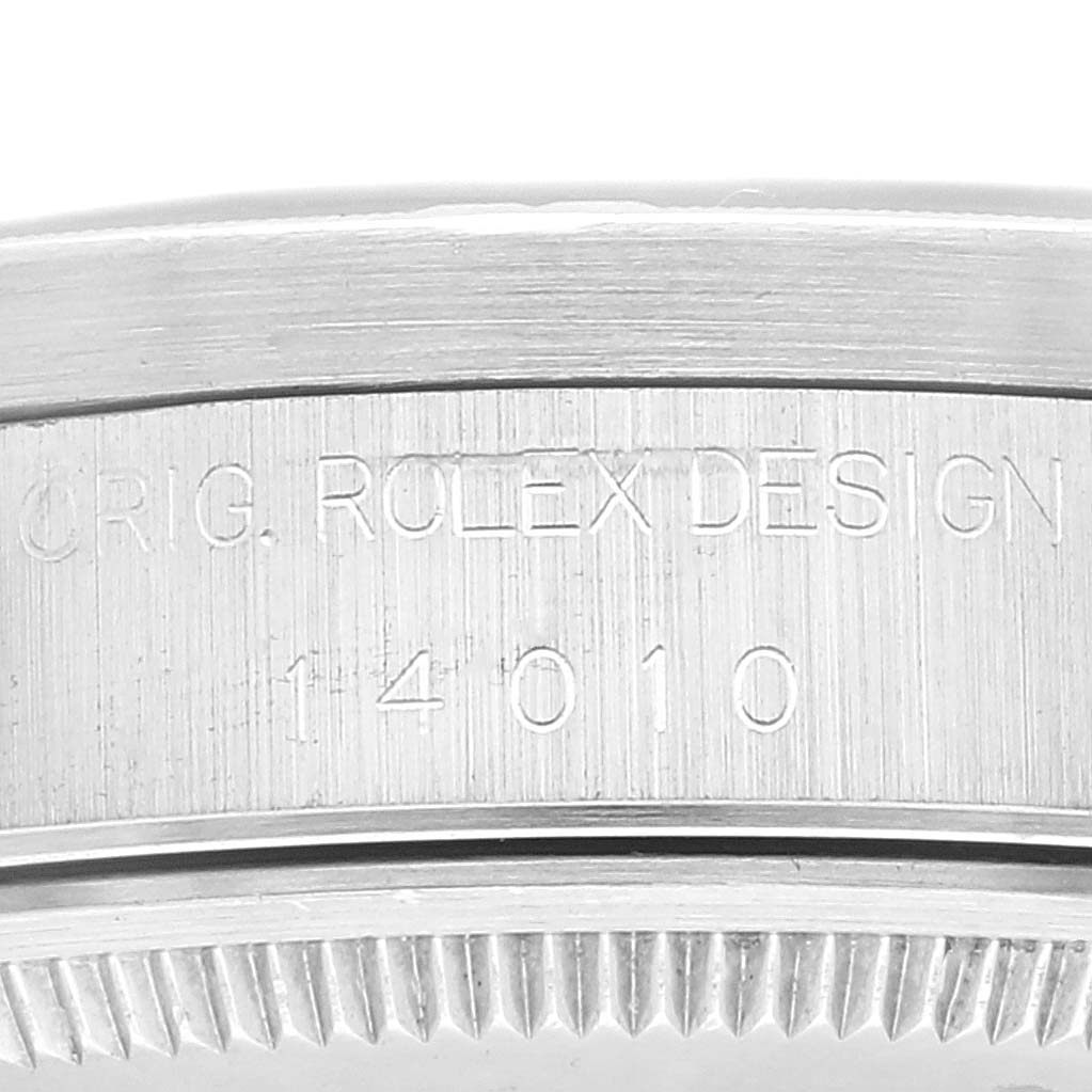 This image shows a close-up of the engraved side of the bezel of a Rolex Air-King 14010 Men's Stainless Steel Black Dial 14010 Men's Stainless Steel Black Dial watch.