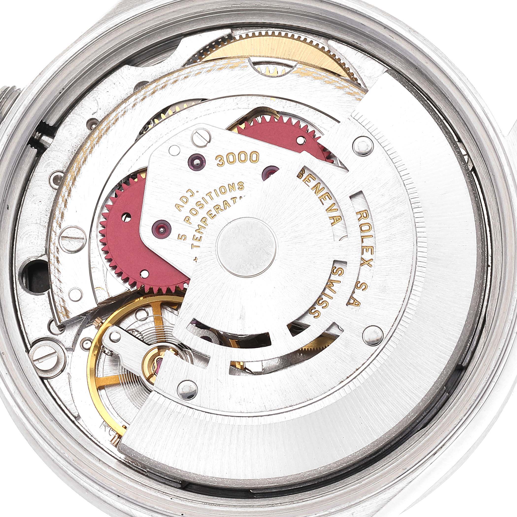 The image shows a close-up view of the internal mechanism of a Rolex Air-King 14010 Men's Stainless Steel Black Dial 14010 Men's Stainless Steel Black Dial watch, highlighting its gears and movement parts.