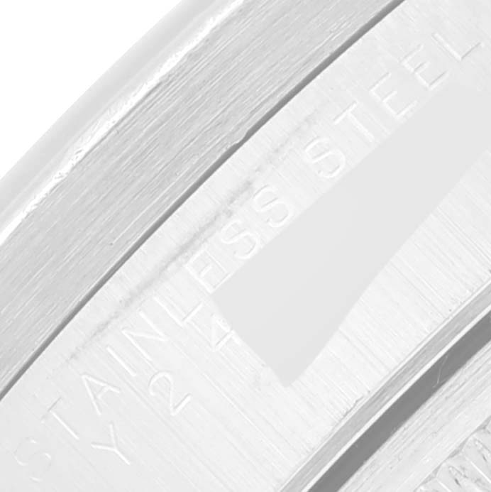 The image shows a close-up of the side of a Rolex Air-King 14010 Men's Stainless Steel Silver Dial 14010 Men's Stainless Steel Silver Dial watch bezel, highlighting the "Stainless Steel" engraving.