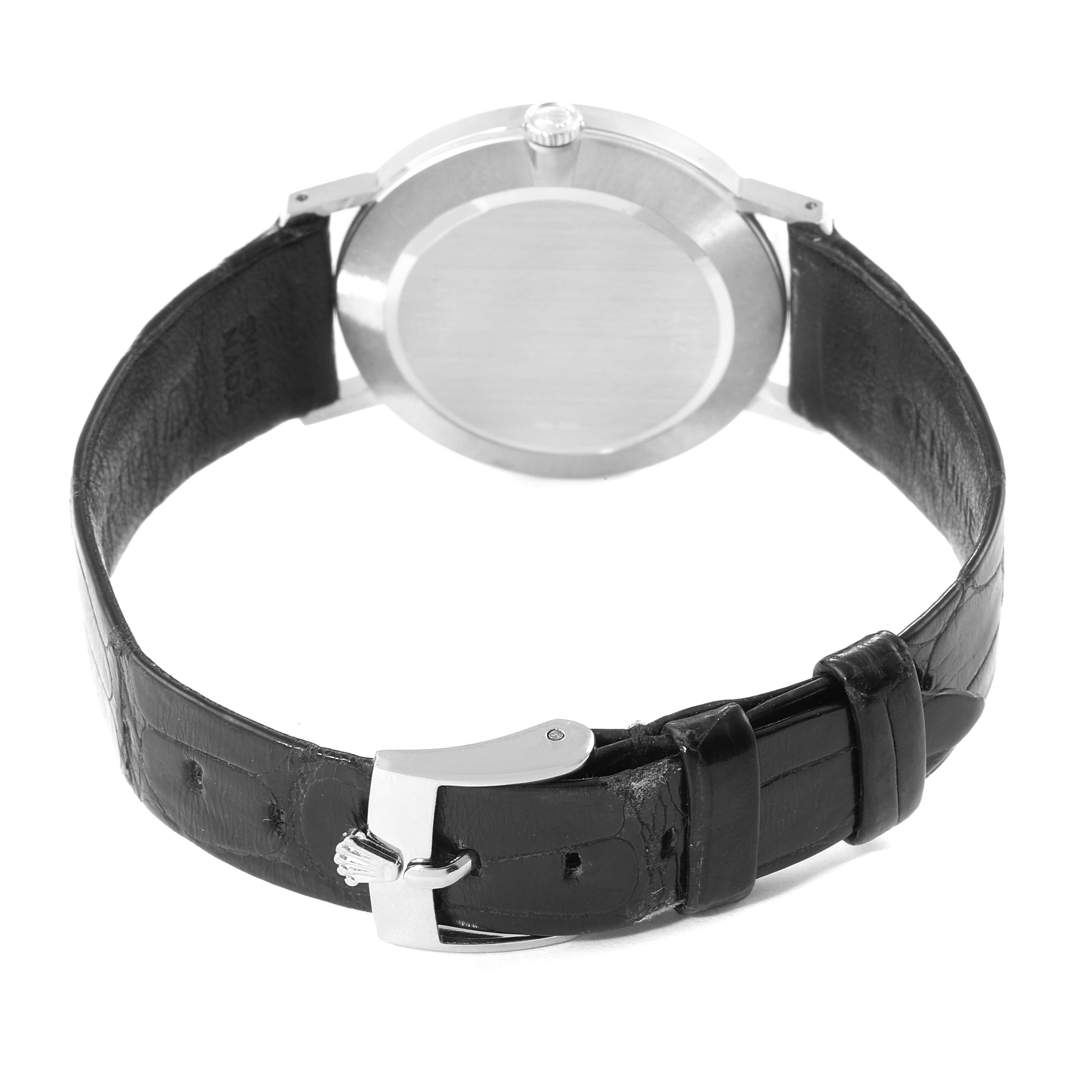 This image shows the back view of a Rolex Cellini 4112 Men's Stainless Steel Silver Dial 4112 Men's Stainless Steel Silver Dial watch, highlighting its case back and black leather strap with a buckle.