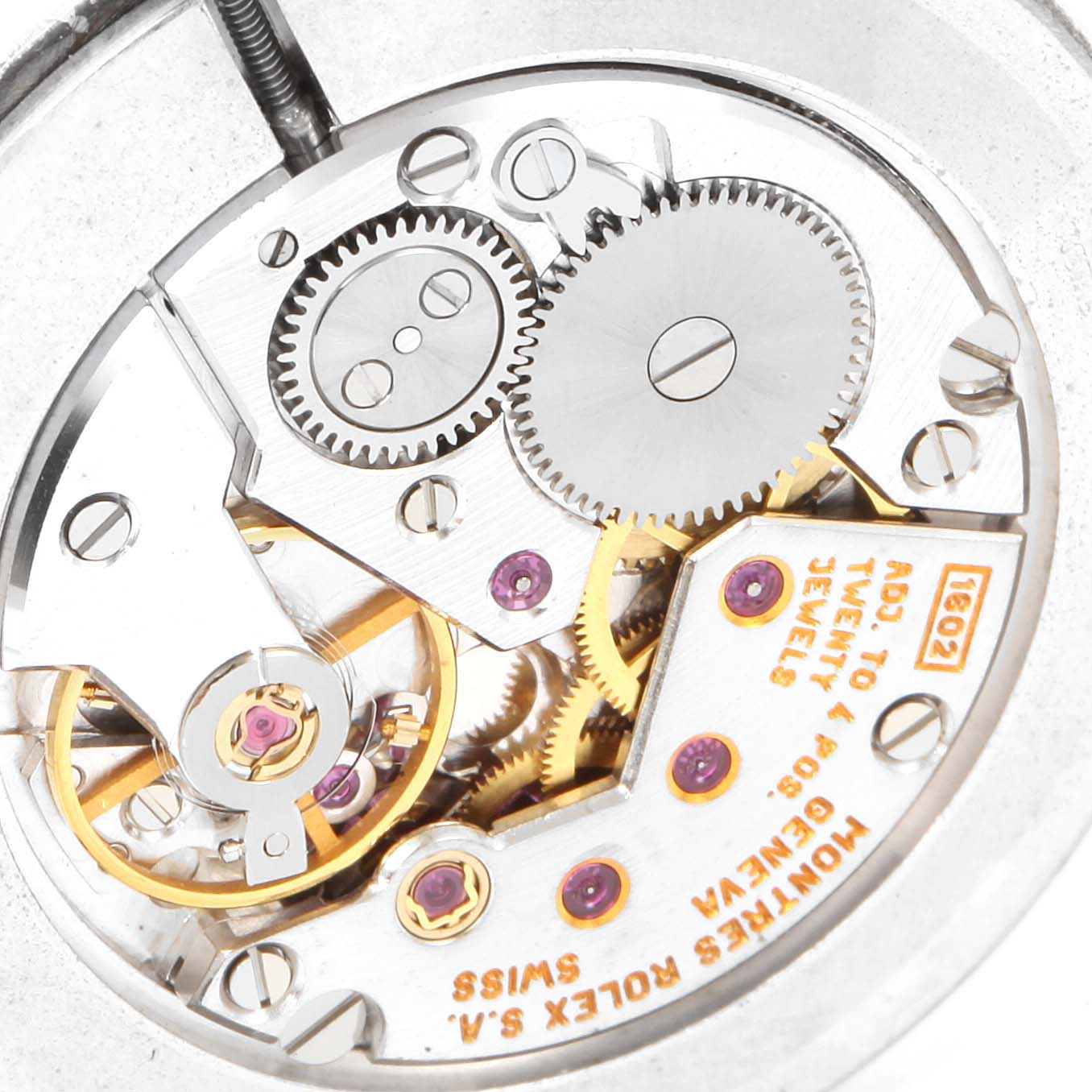 This is an internal view of the Rolex Cellini 4112 Men's Stainless Steel Silver Dial 4112 Men's Stainless Steel Silver Dial watch, showing its intricate mechanical movement and gears.