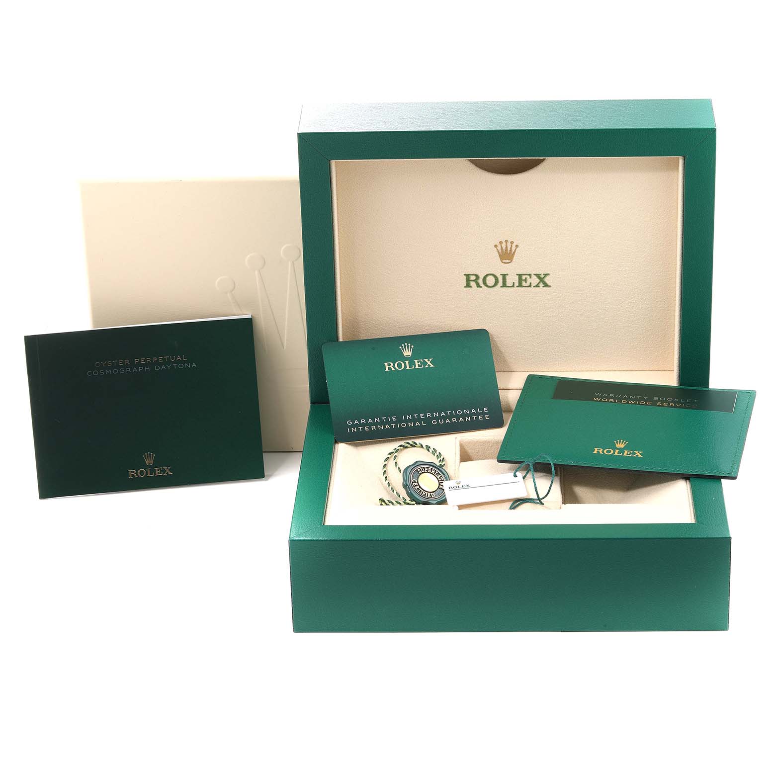 The image shows a Rolex Daytona 116515LN Men's Rose Gold Silver Dial 116515LN Men's Rose Gold Silver Dial watch packaging with manuals, guarantee card, and accessories at an angle displaying the box's interior.