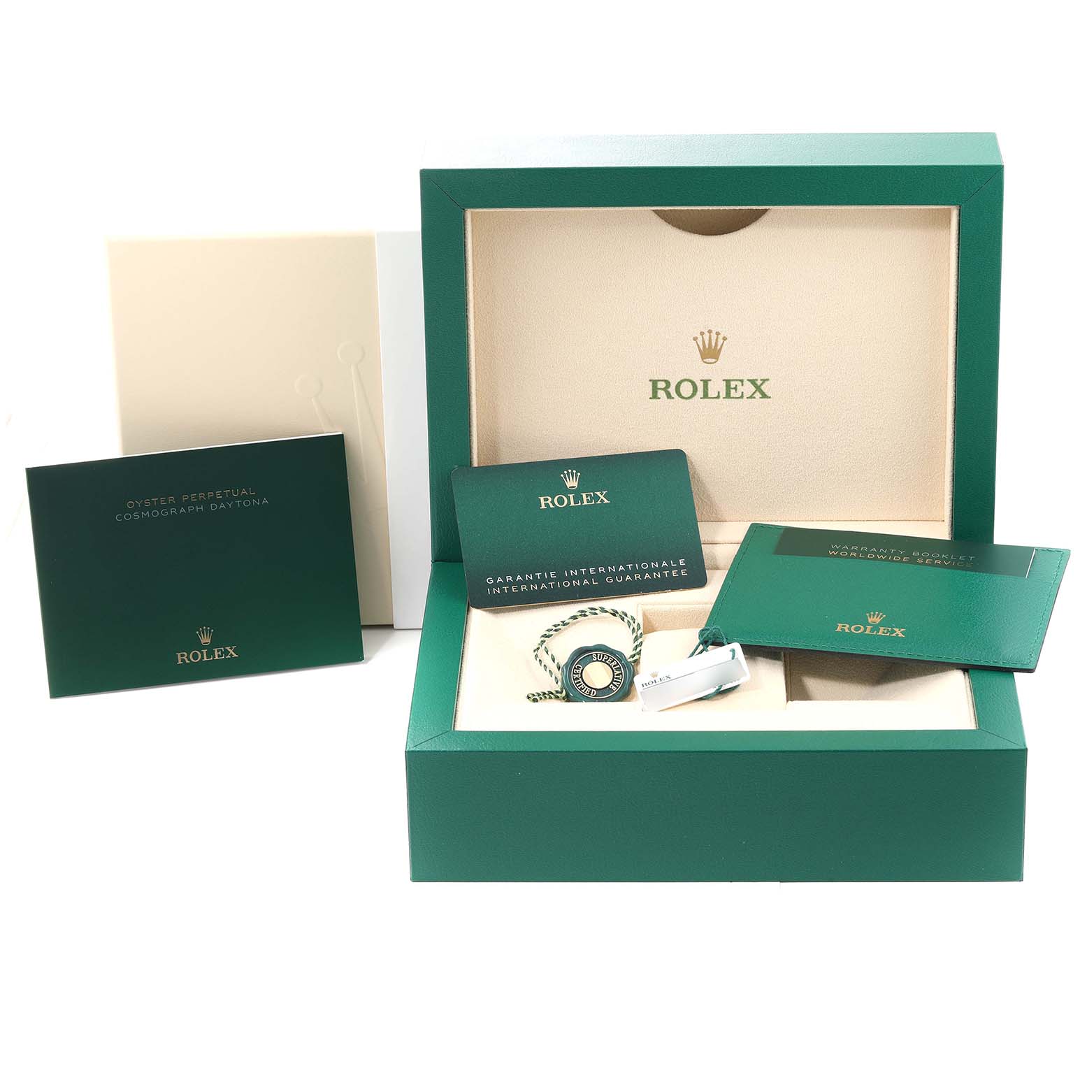 The image shows the Rolex Yacht-Master watch packaging, including the green box, guarantee cards, and manuals.
