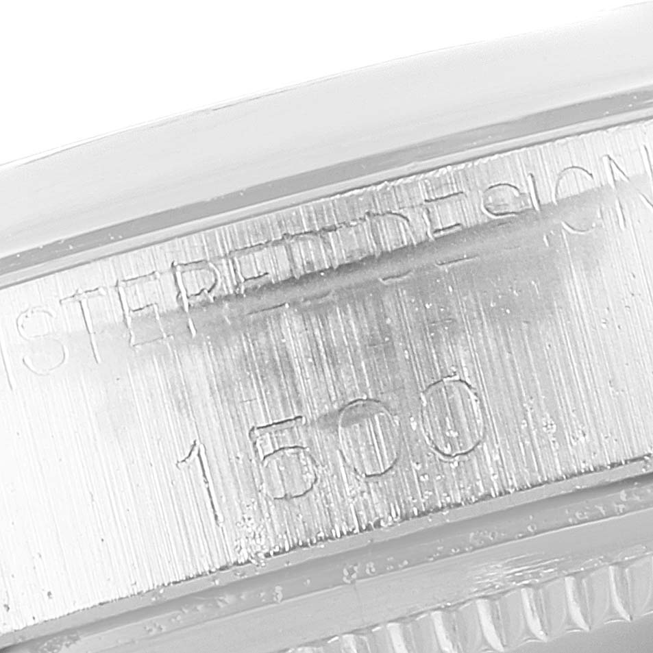 The image shows the side view of the case of a Rolex Vintage Collection 1500 Men
s Stainless Steel Grey Dial 1500 Men
s Stainless Steel Grey Dial watch, focusing on the model number engraving.