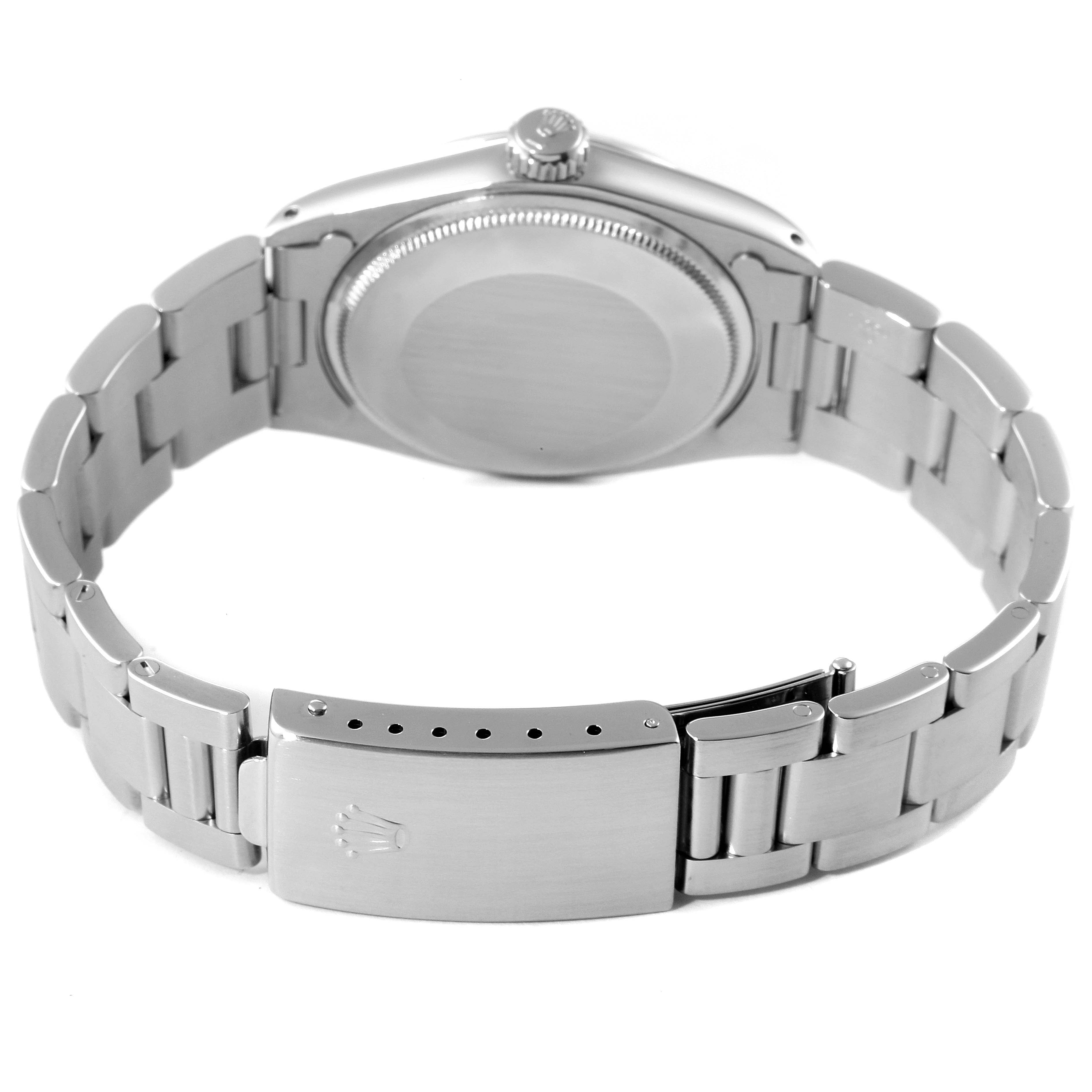 This image shows the back case, crown, and bracelet of a Rolex Vintage Collection 1500 Men
s Stainless Steel Grey Dial 1500 Men
s Stainless Steel Grey Dial model watch.