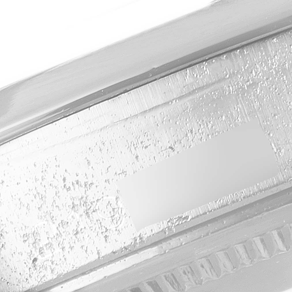 This close-up image focuses on the bezel and case edge of a Vintage Collection model by Rolex.