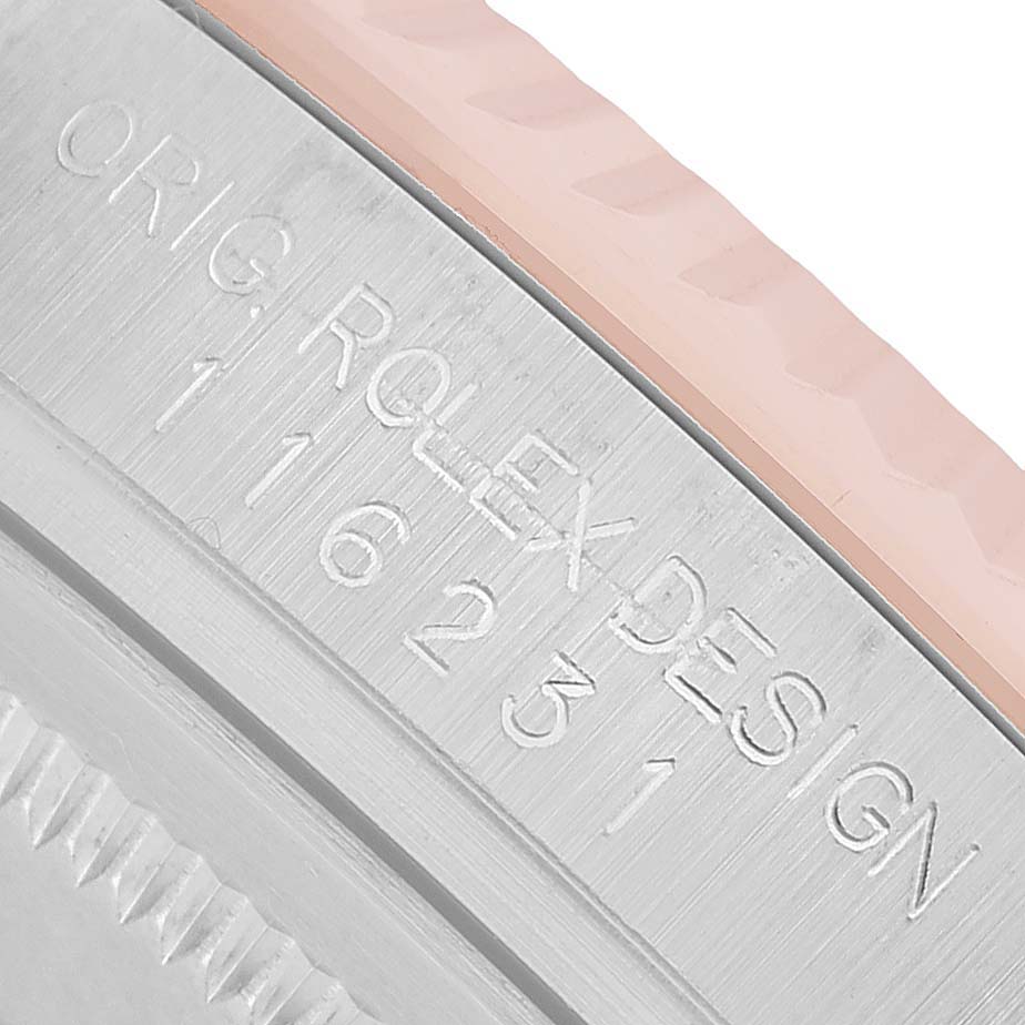 The image shows an angled close-up of the Rolex Datejust 116231 Men's Steel and Gold (two tone) Black Dial model's case edge, displaying engraving details.