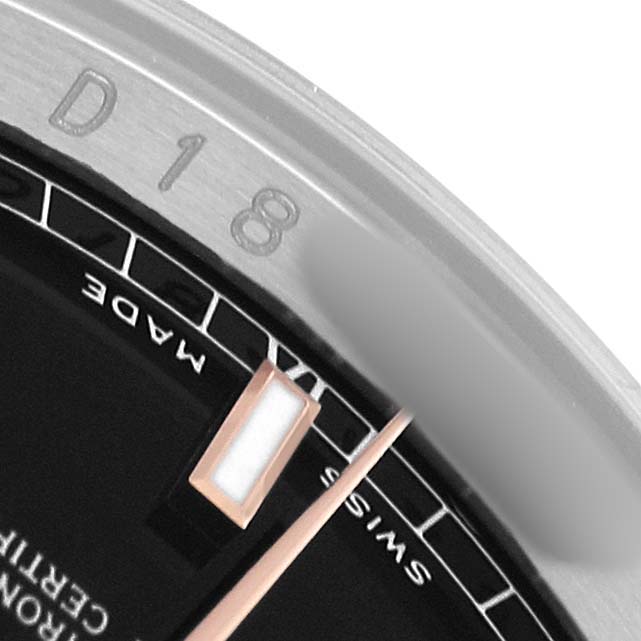 The image shows a close-up of the edge of the dial and bezel of a Rolex Datejust 116231 Men's Steel and Gold (two tone) Black Dial watch, highlighting the date indicator.