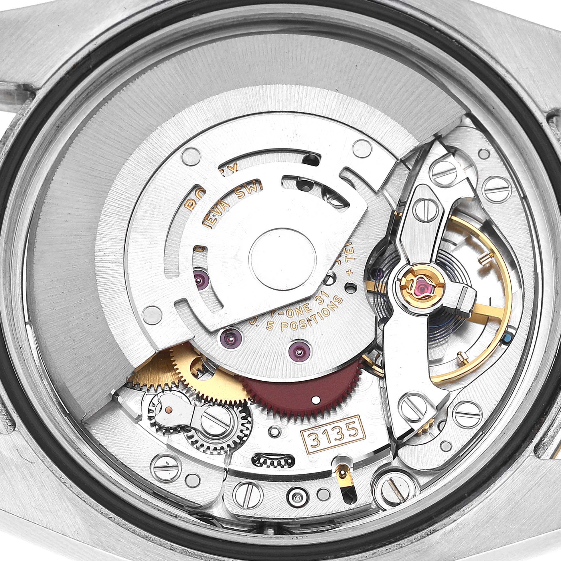 The image shows the intricate movement of a Rolex Datejust 116233 Men's Stainless Steel Silver Dial watch, viewed from a top-down angle.