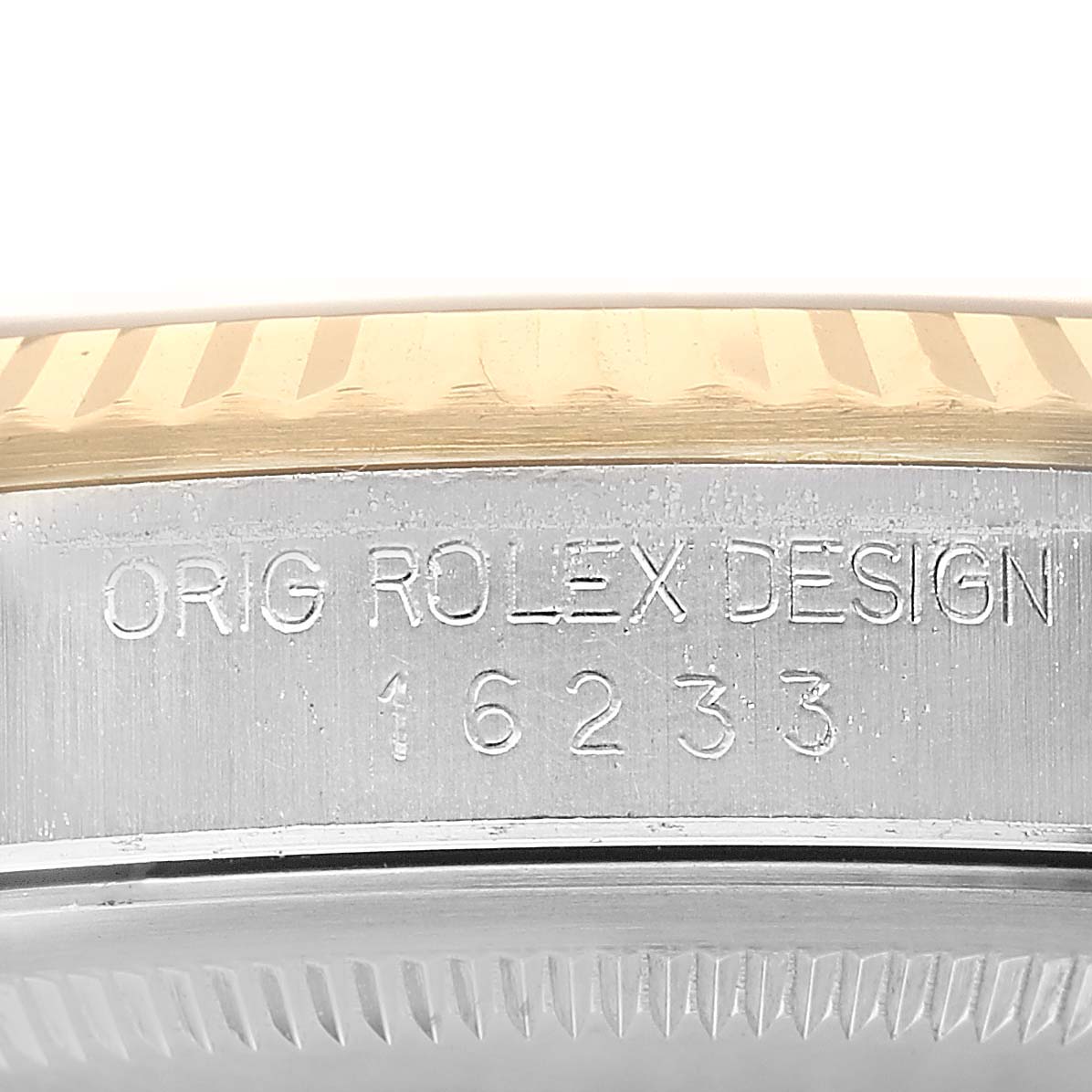 The image shows a close-up side view of the Rolex Datejust 16233 Men's Steel and Gold (two tone) White Dial case, focusing on the bezel and engraved design number.