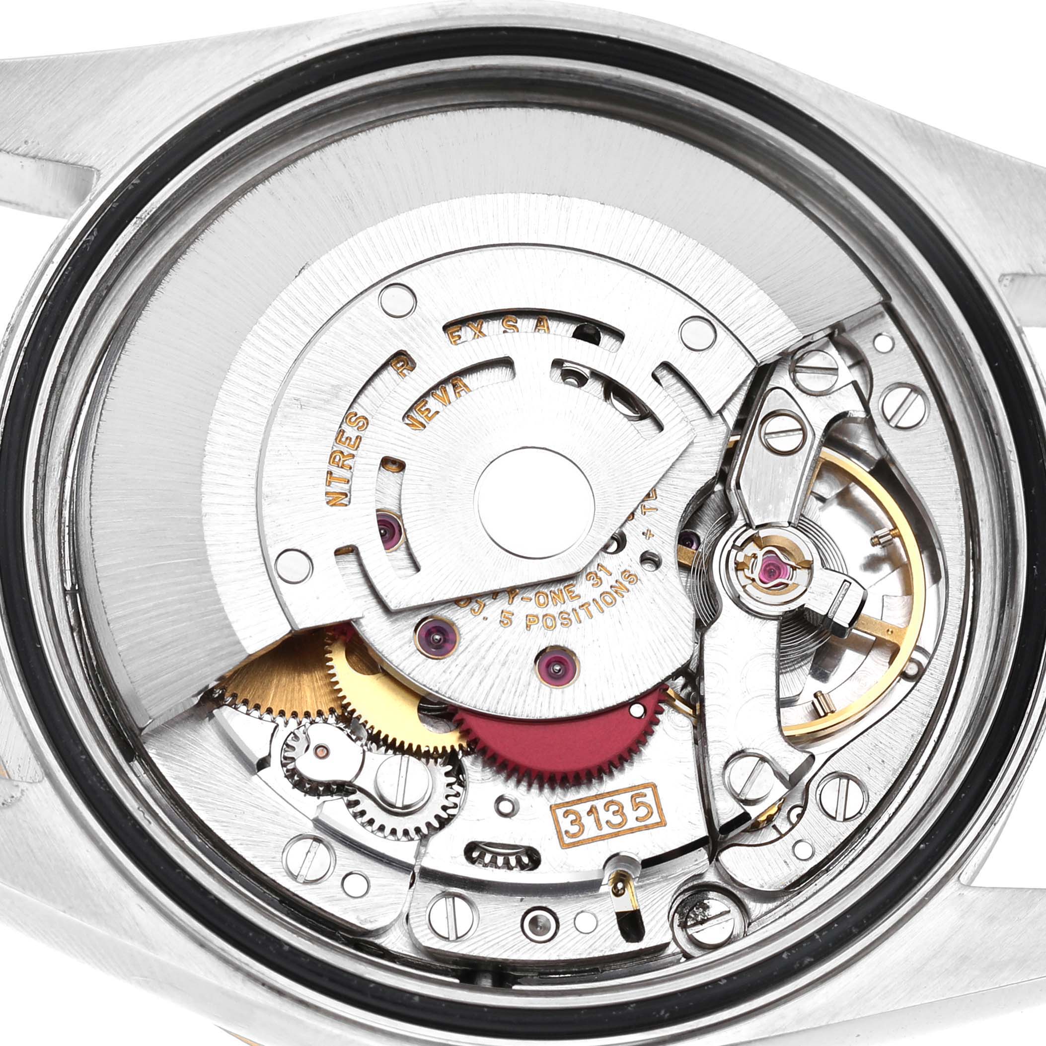 This image shows the movement of a Rolex Datejust 16233 Men's Steel and Gold (two tone) White Dial, viewed from the back, displaying its intricate internal components.