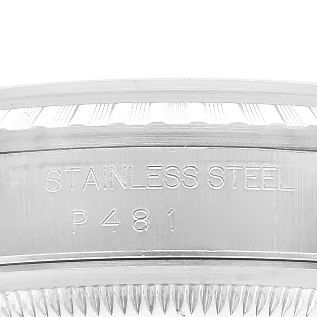 The image shows a close-up of the edge and engraved details of a Rolex Datejust 16220 Men's Stainless Steel White Dial 16220 Men's Stainless Steel White Dial watch case, focusing on the "Stainless Steel" inscription.