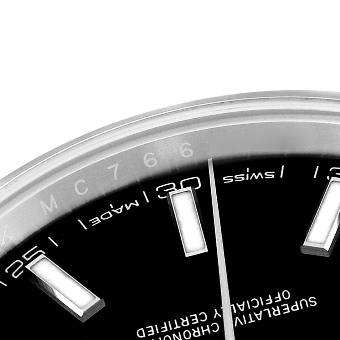 The image shows a close-up of the dial and hour markers of a Rolex Datejust 41 126300 Men
s Stainless Steel Black Dial 126300 Men
s Stainless Steel Black Dial watch, focusing on the "Swiss Made" text and markers around the 6 o
clock position.