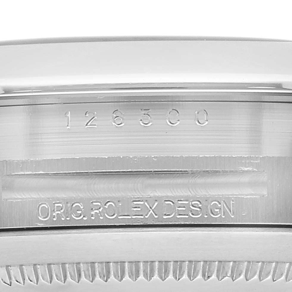 This is an angled close-up of the case back and bezel edge of a Rolex Datejust 41 126300 Men
s Stainless Steel Black Dial 126300 Men
s Stainless Steel Black Dial, showing the model number and "ORIG. ROLEX DESIGN" engraving.