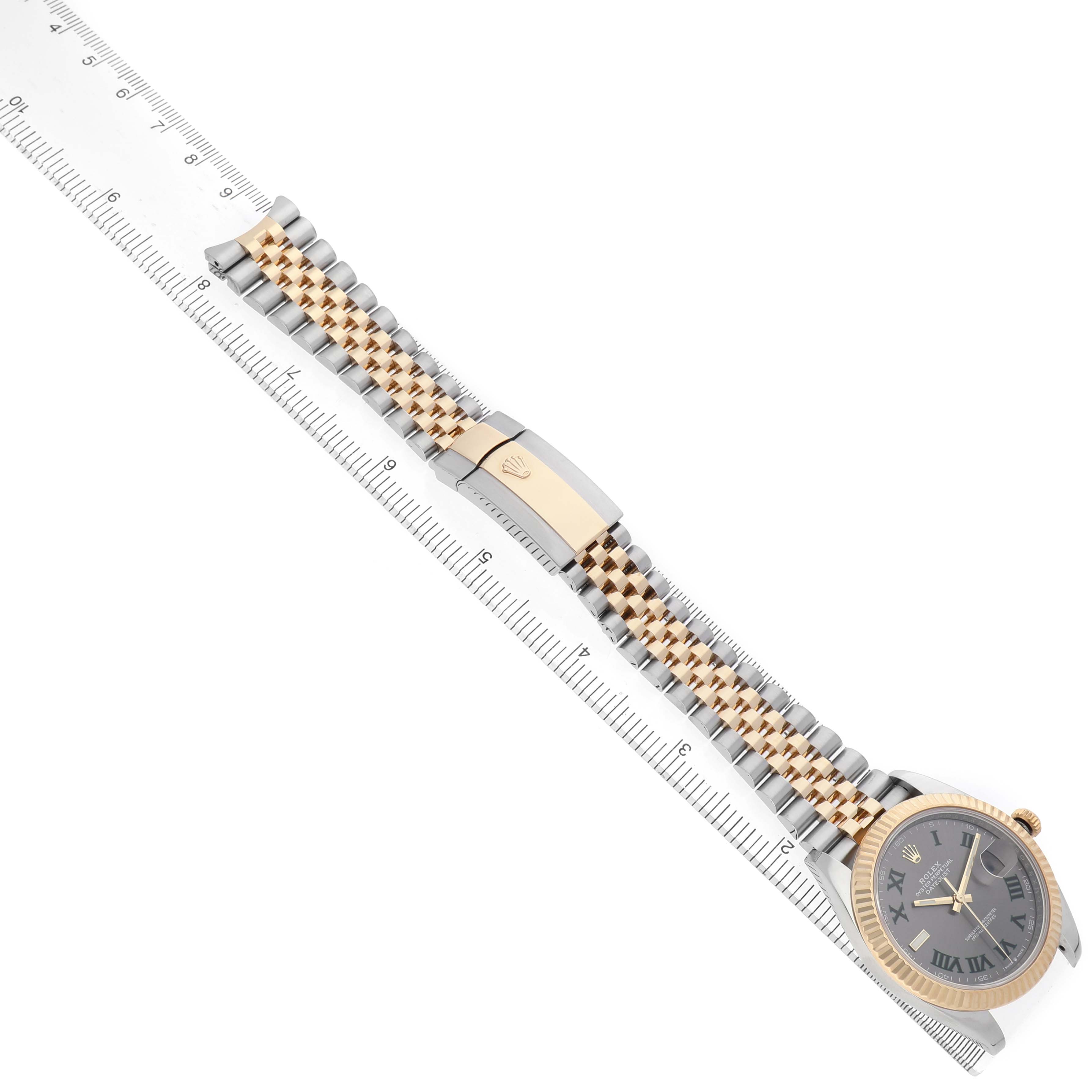 The Rolex Datejust 41 126333 Men's Steel and Gold (two tone) Grey Dial watch is shown from a top view, highlighting the face, bezel, and two-tone bracelet alongside a ruler.