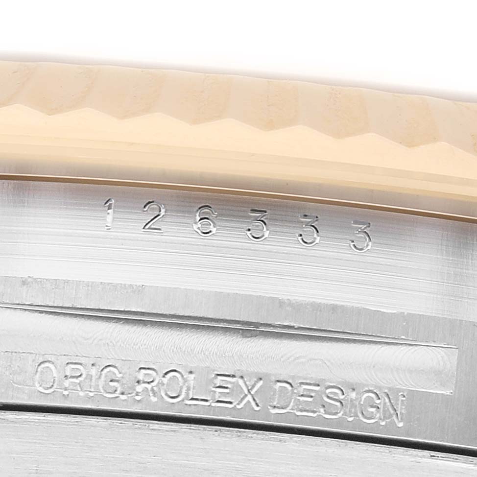 The image shows the side of the Rolex Datejust 41 126333 Men's Steel and Gold (two tone) Grey Dial, highlighting its serial number and "ORIG. ROLEX DESIGN" engraving.