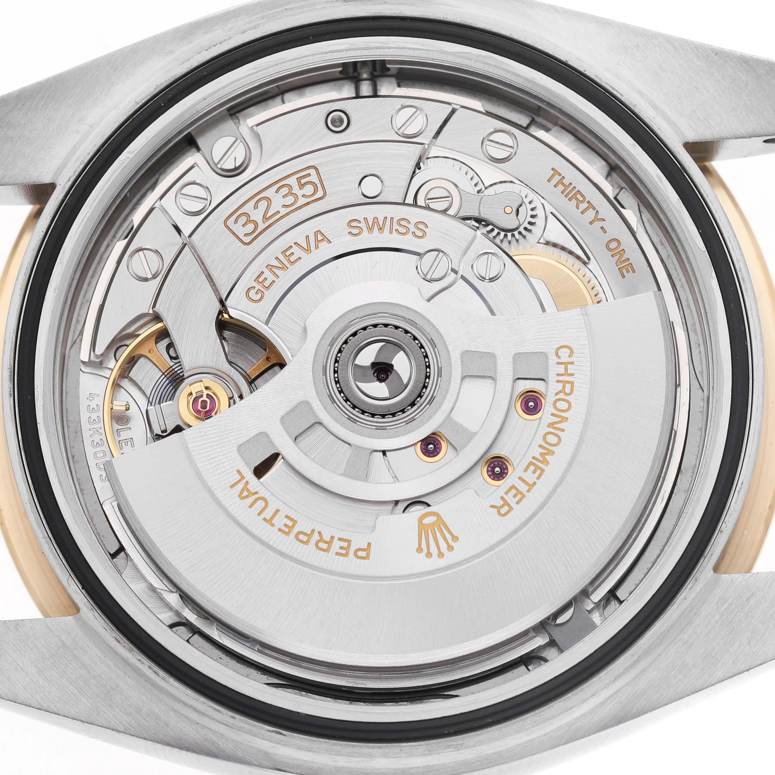 The image shows the movement of a Rolex Datejust 41 126333 Men's Steel and Gold (two tone) Grey Dial, viewed from the back highlighting the intricate internal mechanics.