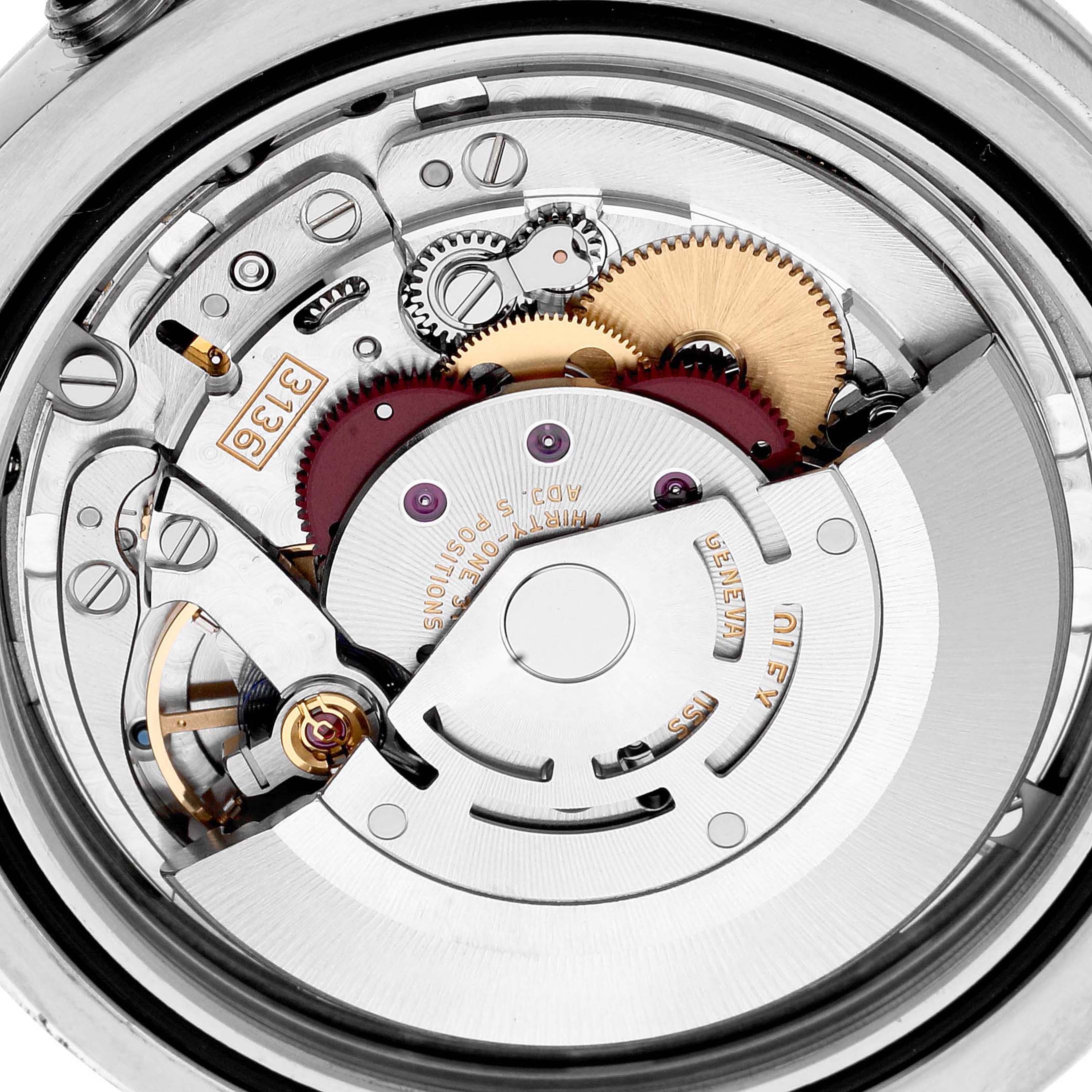 This is a close-up of the internal mechanism of a Rolex Datejust 41 116334 Men
s Stainless Steel Blue Dial 116334 Men
s Stainless Steel Blue Dial watch, showing the gears and movement parts.