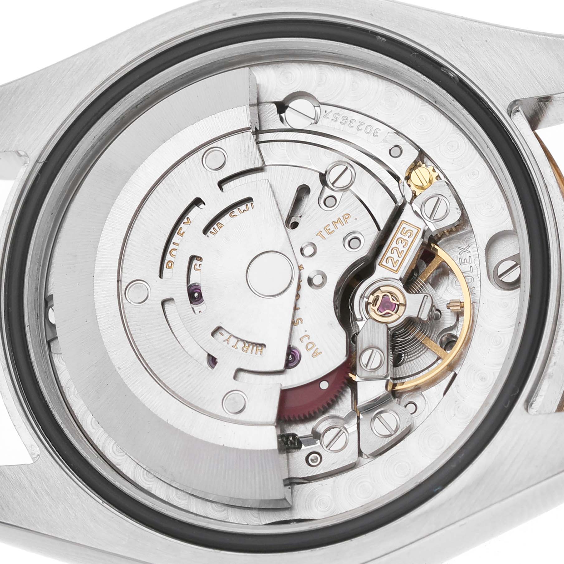 The image shows the movement and internal components of the Rolex Mid-Size 178273 Women's Steel and Gold (two tone) Champagne Dial watch from a rear angle.