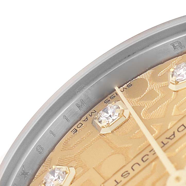 This image shows a close-up of a Rolex Mid-Size 178273 Women's Steel and Gold (two tone) Champagne Dial watch dial with diamond markers and part of the bezel.