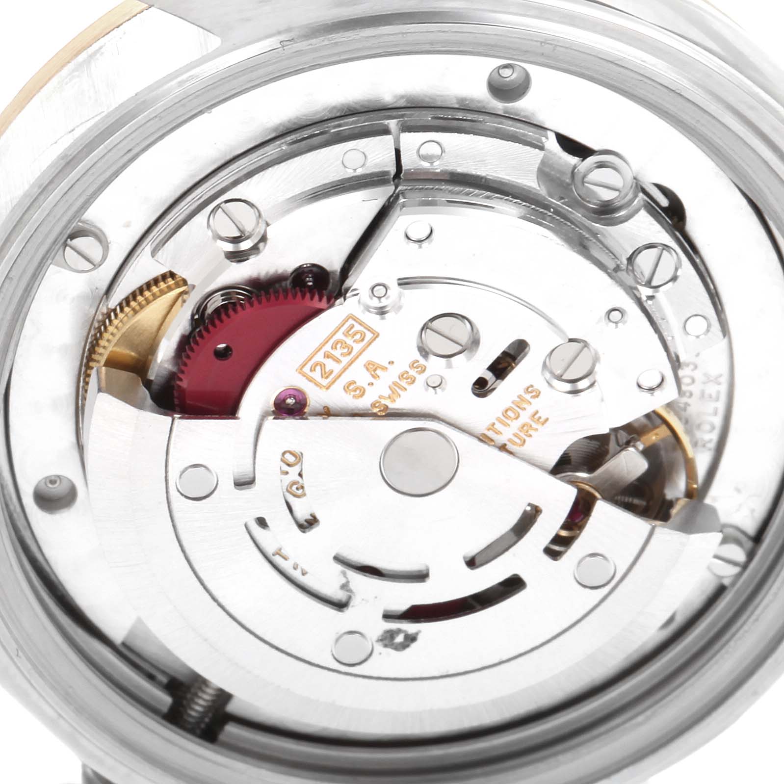 The image shows a close-up view of the movement inside a Mid-Size Rolex watch.