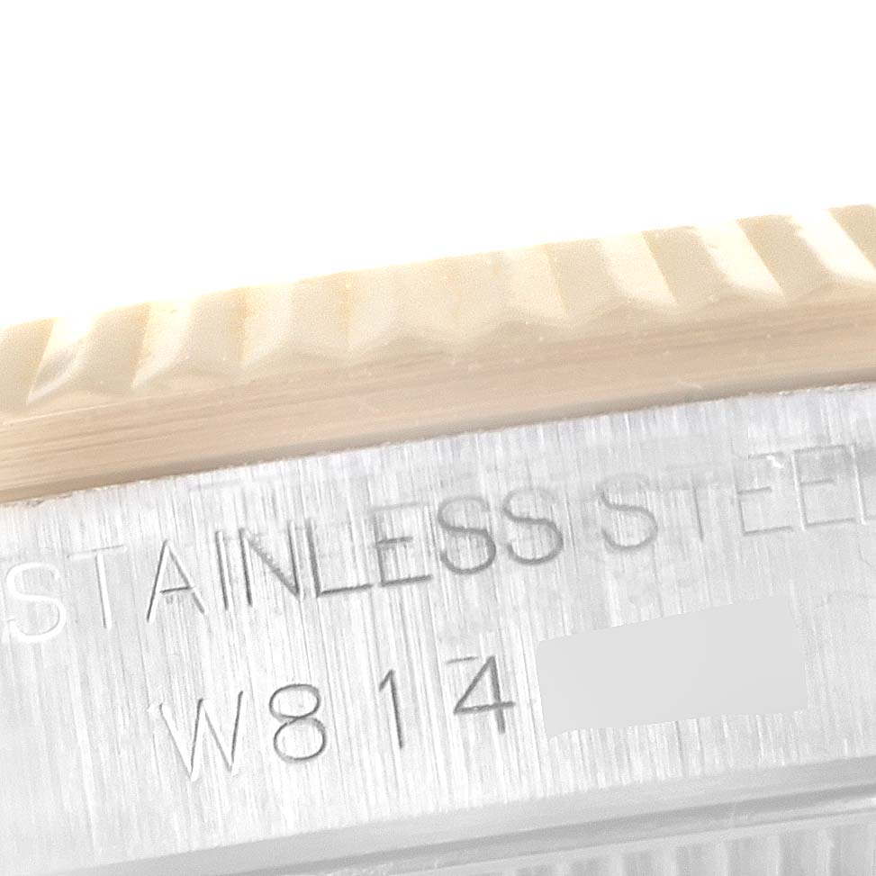 This close-up image shows the bezel and inscription on the mid-case of a Mid-Size Rolex watch.