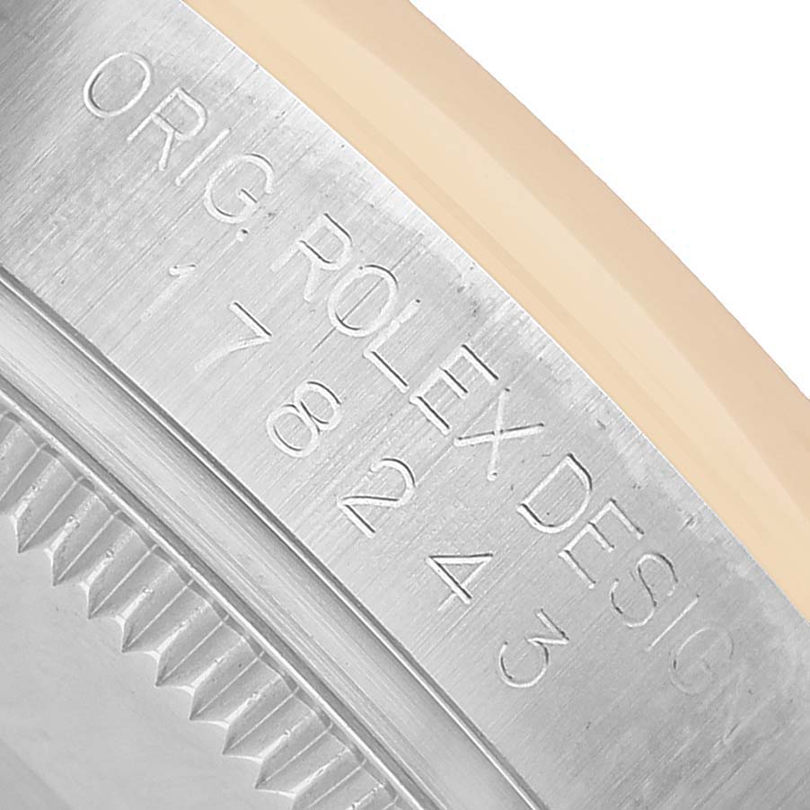 The image shows a close-up of the side engraving on a Rolex Mid-Size 178243 Women's Stainless Steel White Dial watch, highlighting "Orig. Rolex Design."